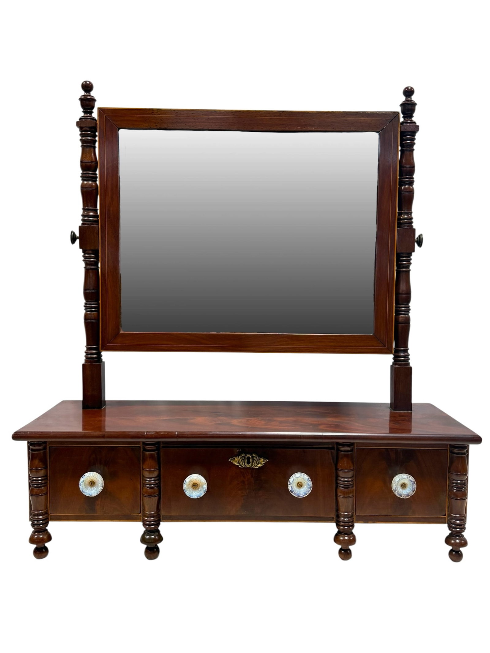 19th C. American Flame Mahogany Dressing Mirror: 19th C. American Flame Mahogany Dressing Mirror w/ Opalescent Knobs. Mirror frame has band inlay and drawer frames have inlay as well. Measures 30" H x 27.5" W x 9.5" D. 1 knob is chipped but overall 
