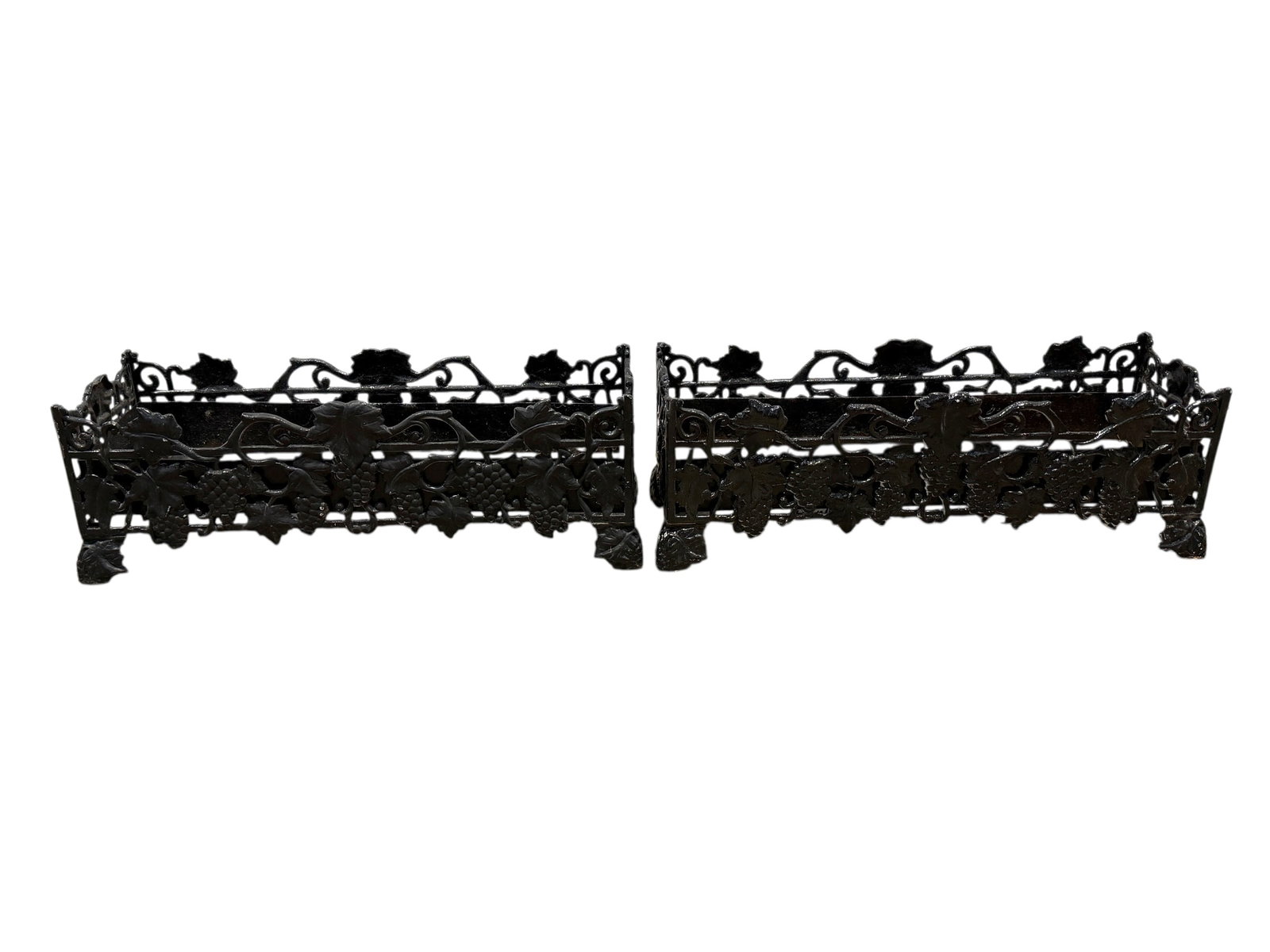 Pair of Painted Black Cast Iron Planters: Pair of Painted Black Cast Iron Planters. Measures 9" H x 27" W x 9" D. Has some scuffs and chips to paint.