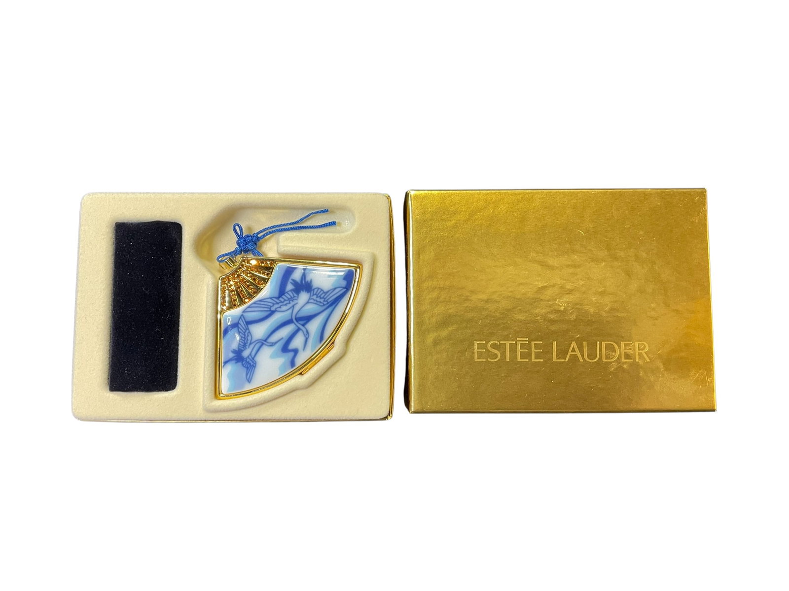 Estee Lauder Lucidity " Asian Fan w/Cranes" Translucent Pressed Powder Compact: Estee Lauder Lucidity " Asian Fan w/Cranes" Translucent Pressed Powder Compact. Measures 2" x 3" and is in original box with drawstring bag. Marked 18J8-06