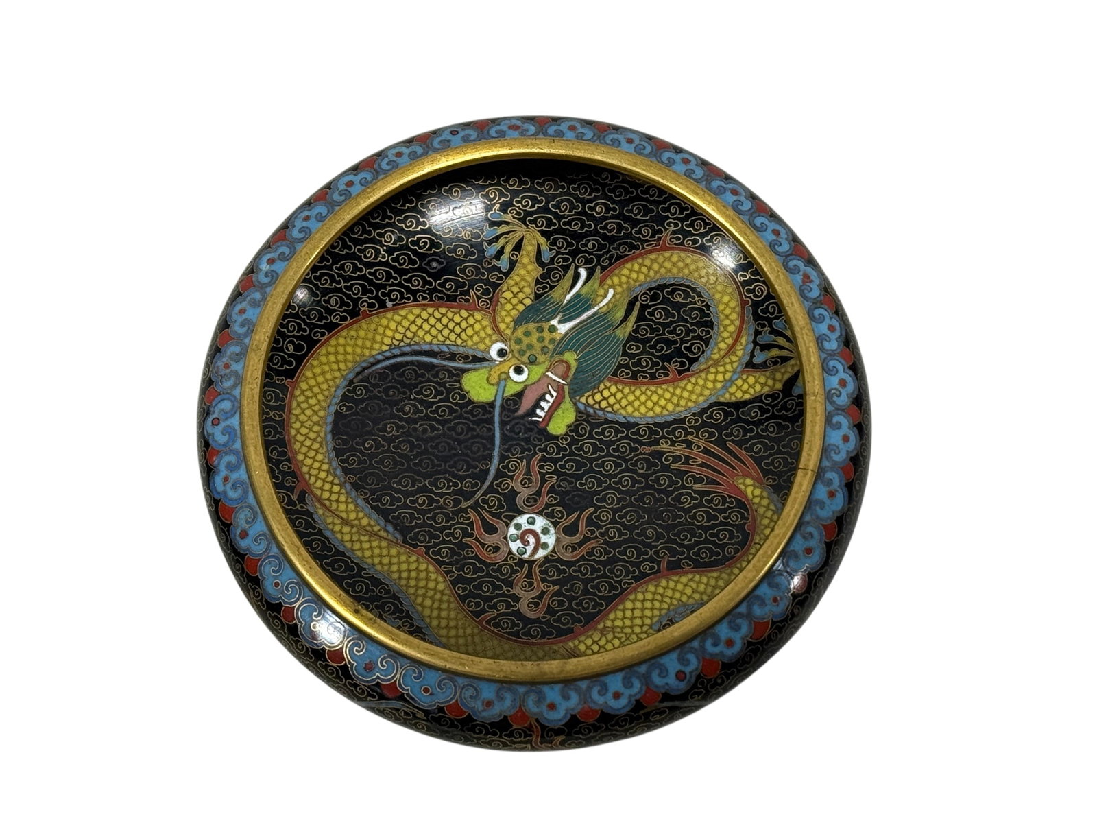 Early 20th C. Chinese Cloisonne Dragon Bowl: Early 20th C. Chinese Cloisonne Dragon Bowl. Depicting dragon in the clouds on the inside of bowl with dragons in the clouds with blue and red scalloped edge on the outside on black background. Measur