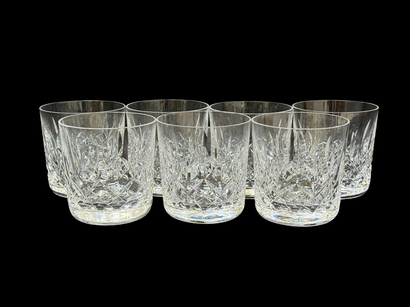 Set of 7 Waterford Lismore Double Old Fashioned Glasses: Set of 7 Waterford Lismore Double Old Fashioned Glasses. Measures 3.5" H x 3.25" W 3.25" D. 1 glass has a very small chip on top rim.
