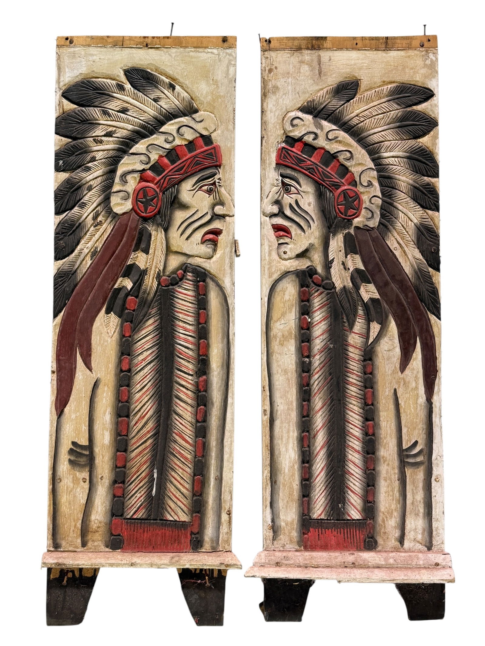 Pair of Antique Painted Carved Wood Panels: Pair of Antique Painted Carved Wood Panels. Depicting native American figures. Measures 28" H x 13.25" W. Condition reflects its age.