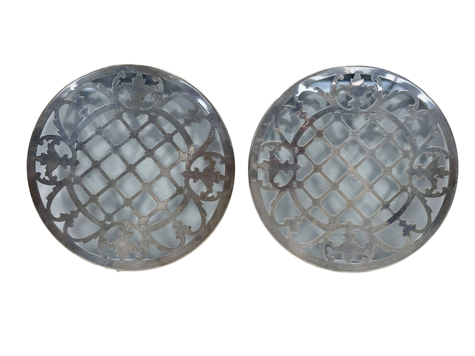 Pair of Sterling & Glass Pot Trivets: Pair of Sterling & Glass Pot Trivets. Marked Sterling on the underside (hard to see). Each measures 7" Diameter. In used condition.