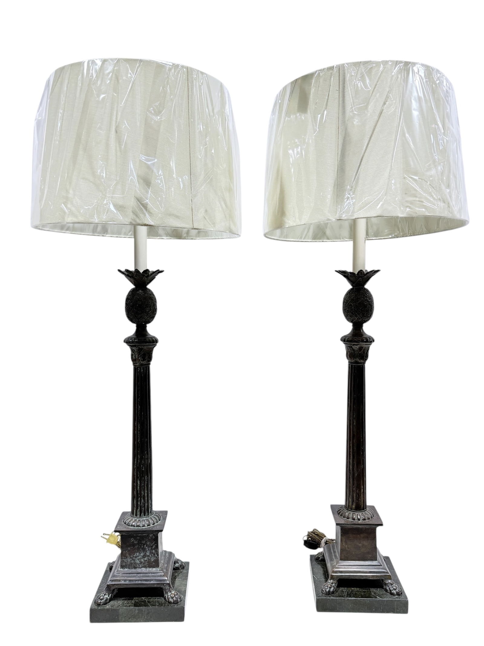 (2) Bronze Maitland Smith Pineapple & Column Candlestick Lamps: (2) Bronze Maitland Smith Pineapple & Column Candlestick Lamps. Labels on the underside of lamps. Measures 40.5" Tall. Is working, marble base has a couple small chips.