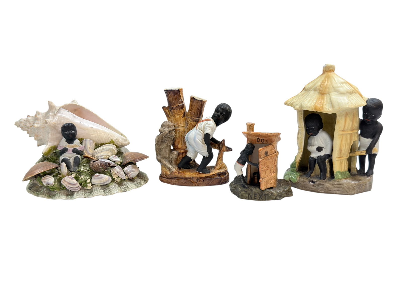 Group of 4 German Bisque Black Boy Figures: Group of 4 German Bisque Black Boy Figures. Measurements follow as pictured: 2.25" Tall, 3.25" H x 2.5" W, 4" H x 3" W x 2.5" D & 2.75" H x 4.5" W x 4" D. Has some small chips.