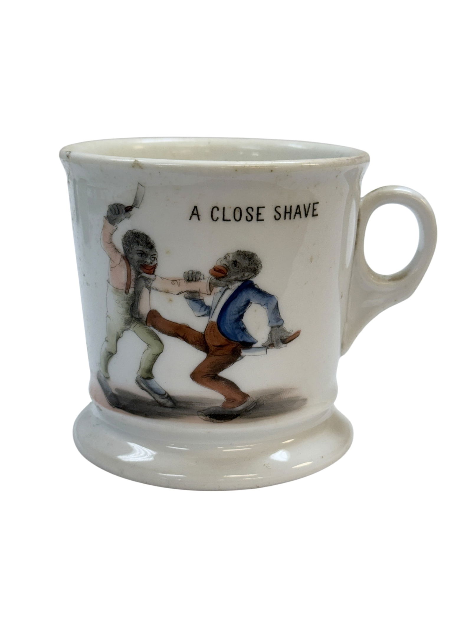 K.P.M. Black Memorabilia "A Close Shave" Shaving Mug: K.P.M. Black Memorabilia "A Close Shave" Shaving Mug. Marked K.P.M. Germany on the underside. Measures3.5" H x 4.5" W x 3.5" D. In used condition.