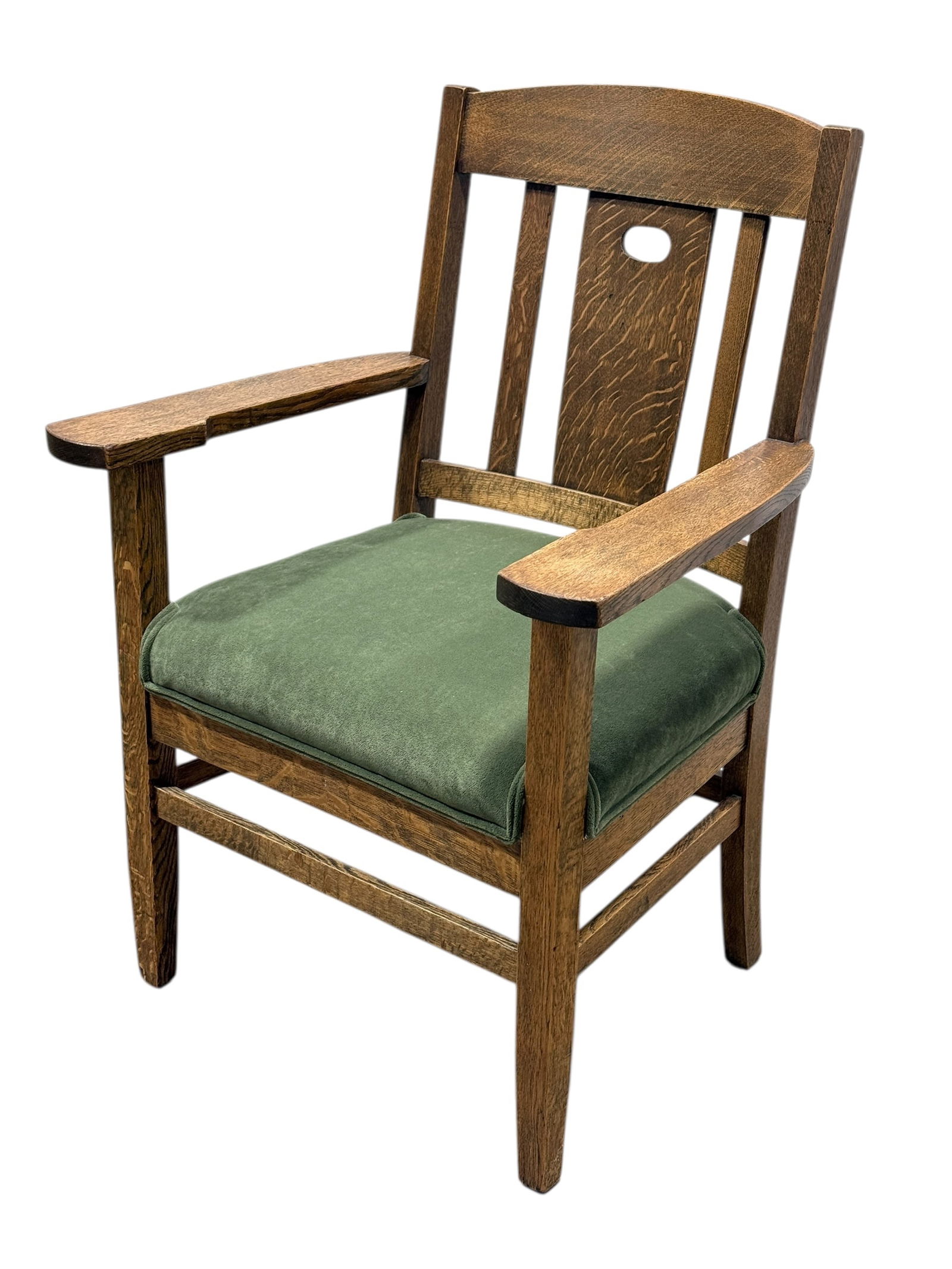 Tiger Oak Armchair in The Style of Stickley: Tiger Oak Armchair in The Style of Stickley. Measures 38.25" H x 27" W x 26" D and seat height measures 20" H. Has some scuffs and a few discolor spots.