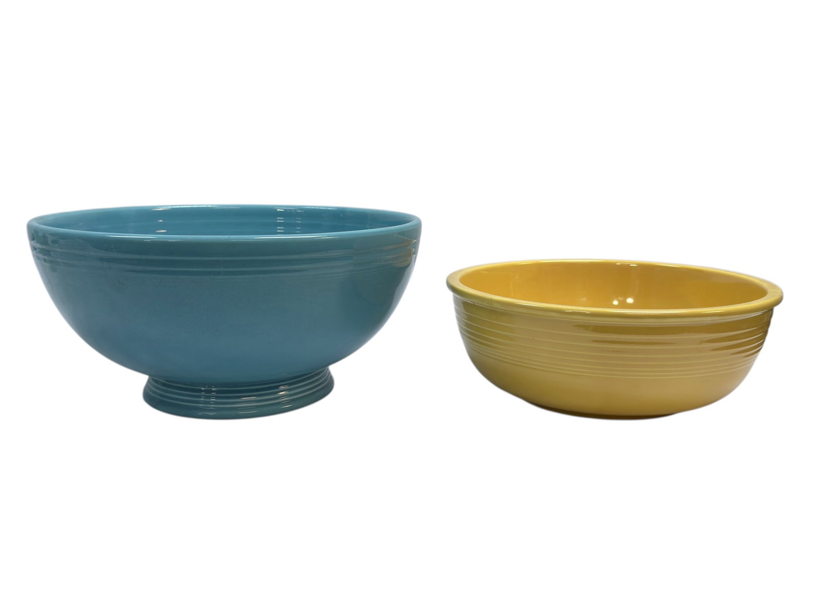 (2) Fiesta Bowls: (2) Fiesta Bowls. Large Blue Fiesta Salad Bowl measures 5.5" H x 11.25" Diameter. Yellow bowl measures 3.5" H x 9.5" Diameter. In used condition.