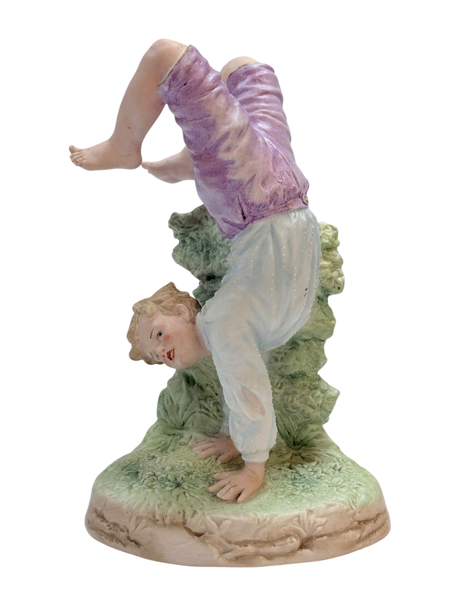 1900 Gebruder Heubach Bisque "Acrobatic Boy" Figurine: 1900 Gebruder Heubach Bisque "Acrobatic Boy" Figurine. German made figurine. Measures 8.5" H x 5.75" W x 4" D. In good condition.
