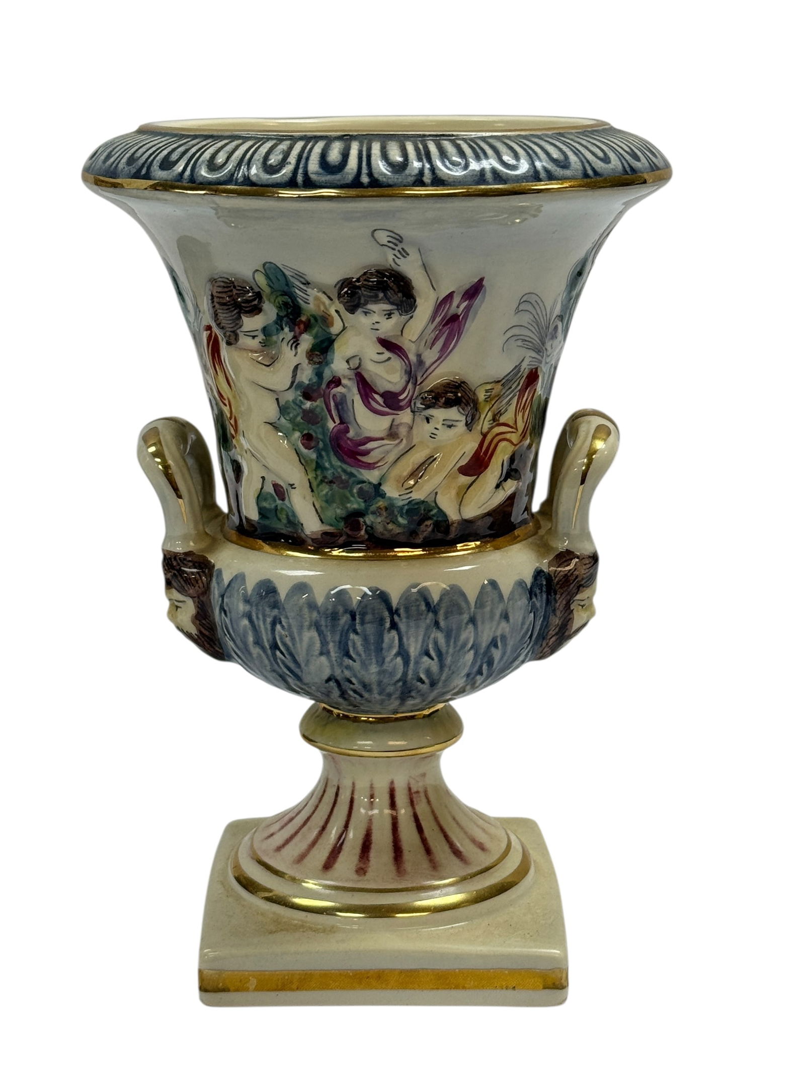 Italian Capodimonte Porcelain Urn Vase: Italian Capodimonte Porcelain Urn Vase. Marked on the underside. Measures 7.75" H x 5.25" Diameter. Has some light scratches.
