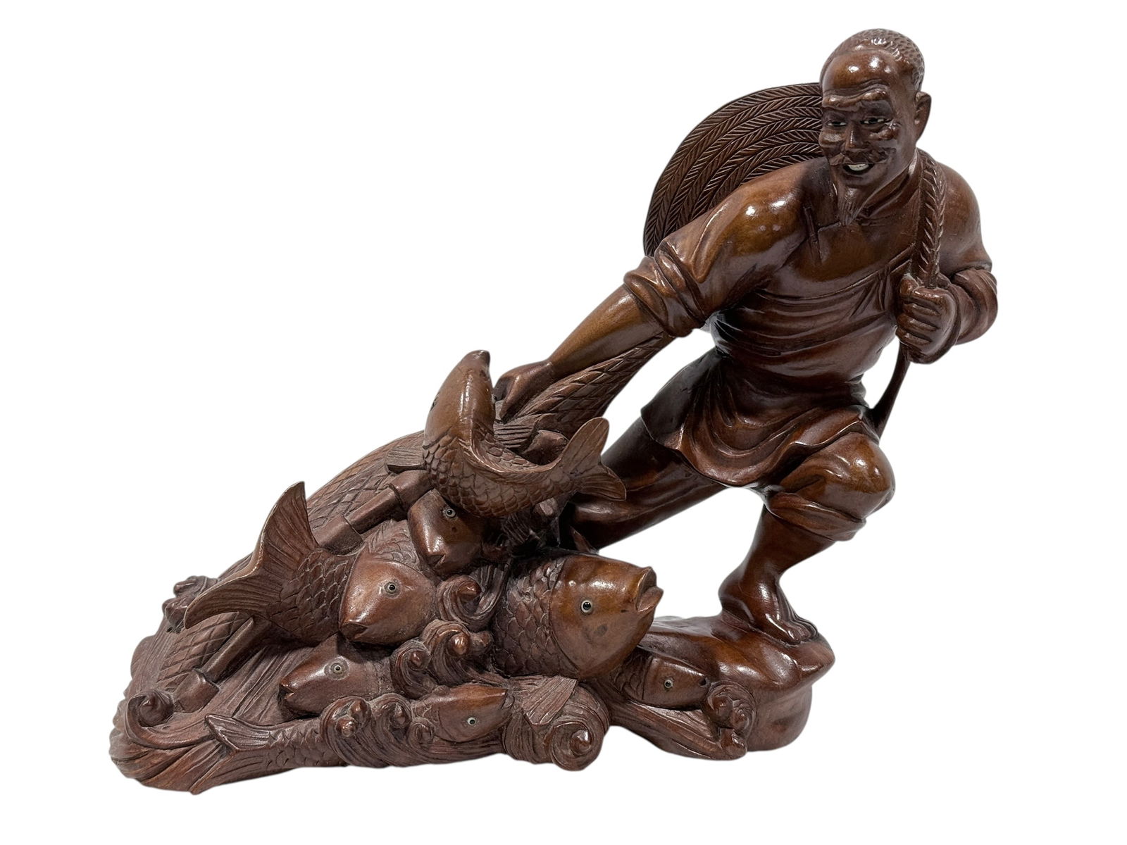 Asian Carved Wood Fisherman w/ Glass Eyes: Asian Carved Wood Fisherman w/ Glass Eyes. Measures 8.25" H x 10.75" W x 3.75" D. In good condition.