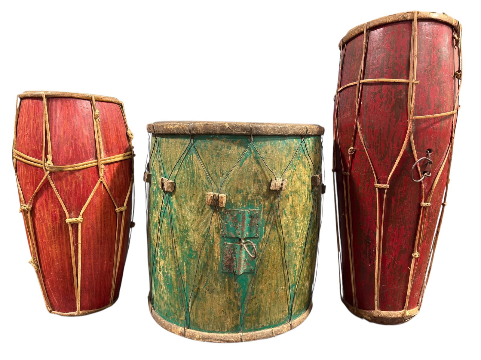 Group of 3 Antique Drums: Group of 3 Antique Drums. (2) Antique Red Javanese Gamelan Drums. Measures 33.25" H x 13" W x 13" D & 25.75" H x 12.5" W x 12.5" D. Condition reflects their age. 1 drum doesn’t sound very good, may