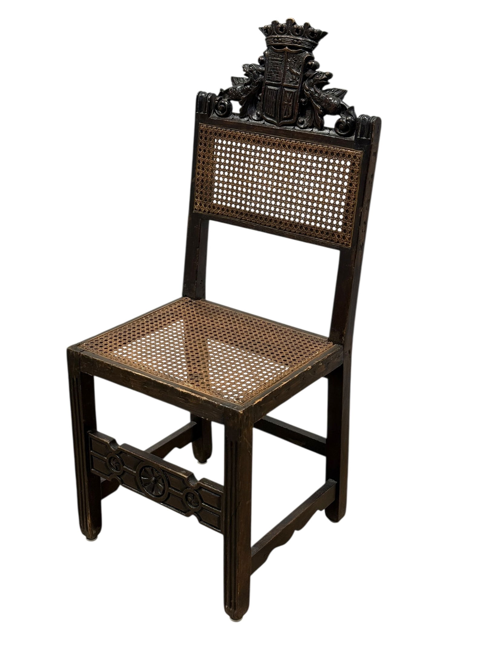 Antique Wood Carved English Caned Chair: Antique Wood Carved English Caned Chair. Measures 42.5" H and seat height measures 18.5" H. Condition reflects its age.