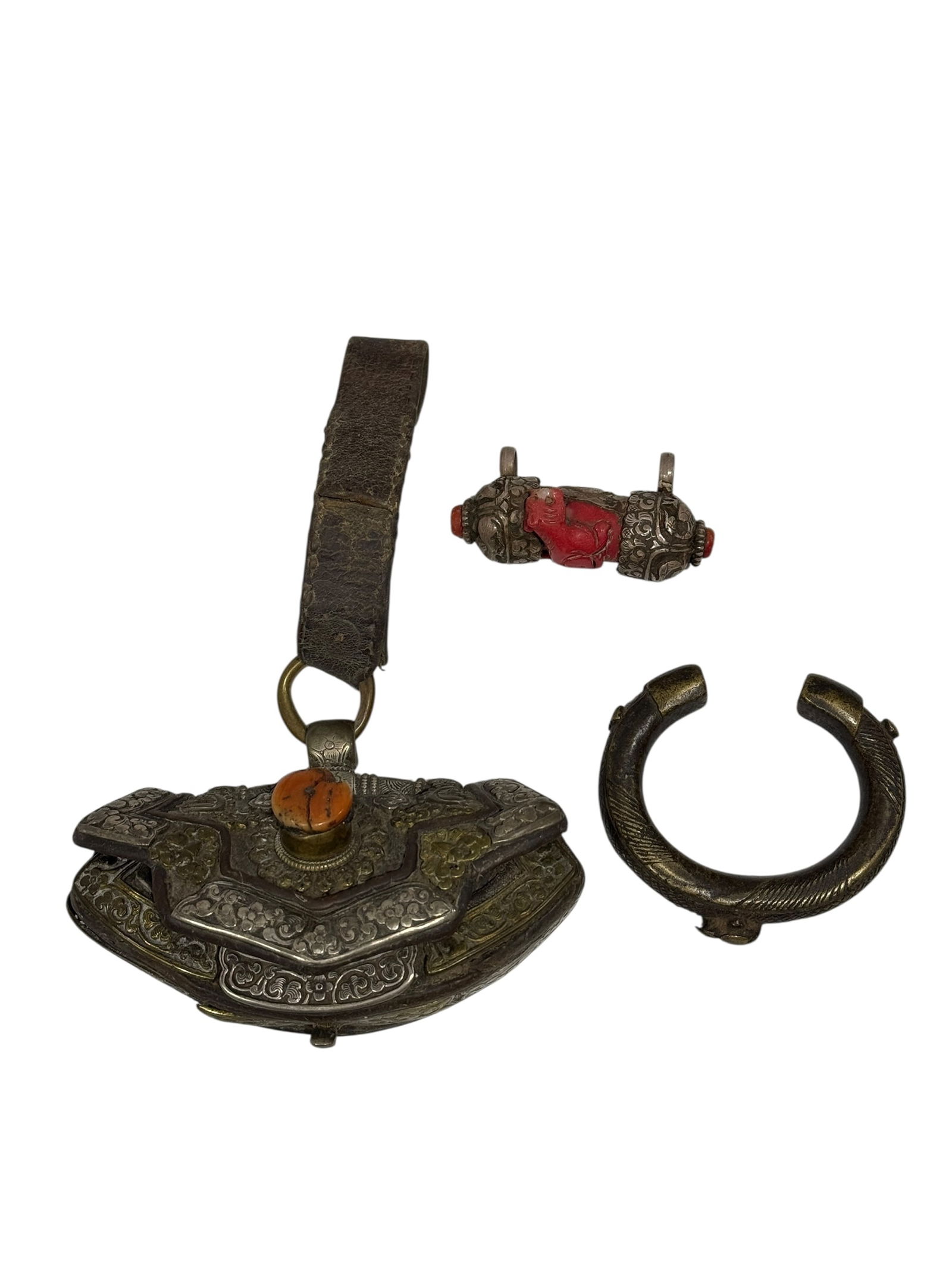 RARE Antique Tibetan Coral Mounted Flint Pouch w/ Silver Mounts: RARE Antique Tibetan Coral Mounted Flint Pouch w/ Silver Mounts. Along with Antique Tibetan Coral mounted on silver pendant and Antique Tibetan Bracelet. Flint Pouch measures 4.75" W, Pendant measures