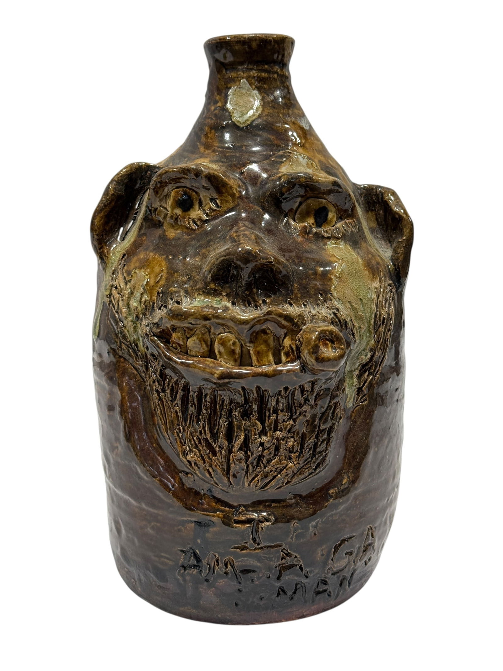 Signed Marie Roger "Jesus Saves" Pottery Face Jug: Signed Marie Roger "Jesus Saves" Pottery Face Jug. Double signed on the back and marked "Jesus Saves" on the backside. Measures 9" H x 5.25" W x 6" D. In good condition.