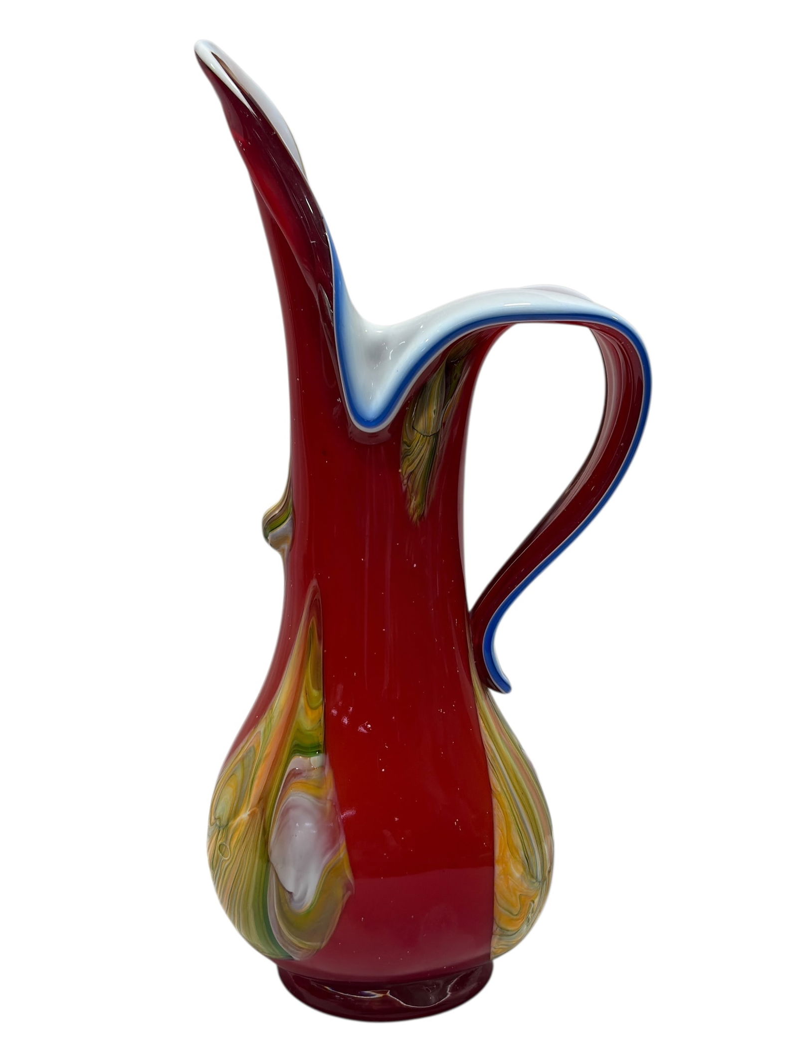 Signed Essie Zareh Hand-Blown Art Glass Pitcher: Signed Essie Zareh Hand-Blown Art Glass Pitcher. Hand-blown art glass pitcher signed Essie Zareh on the base. Features a rich cranberry red body with bold multicolor swirl panels in yellow, green, and