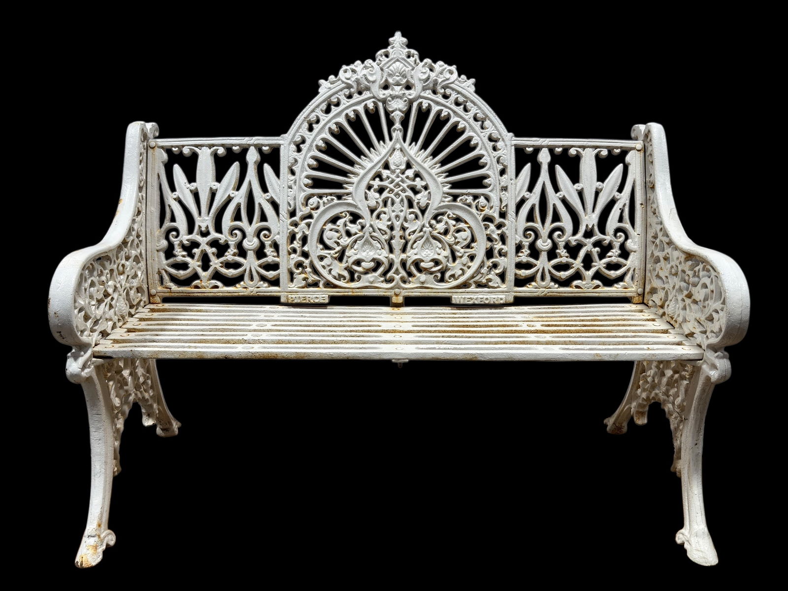 Pierce “Wexford" Style Pattern Cast Iron Garden Bench: Pierce “Wexford” Style Pattern Cast Iron Garden Bench. Cast iron garden bench executed in the ornate Wexford pattern style, featuring a highly decorative pierced back with scrolling foliate mo