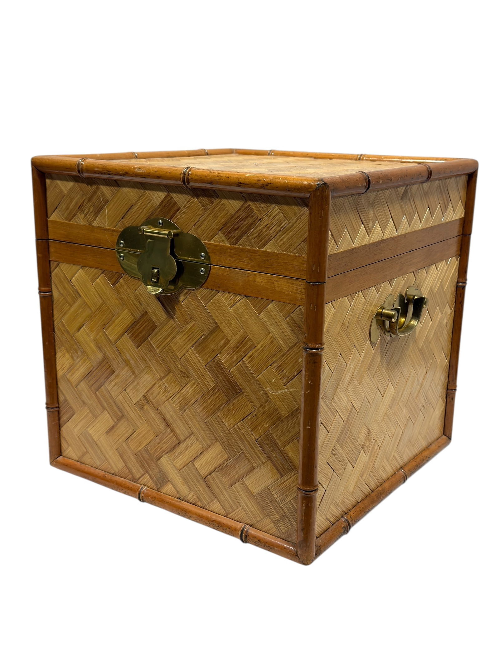 Mid 20th C. Bamboo & Woven Rattan Storage Chest: This mid-20th century bamboo and woven rattan storage chest features a classic herringbone weave panel construction framed by rounded bamboo poles. The box is fitted with original brass hardware, incl