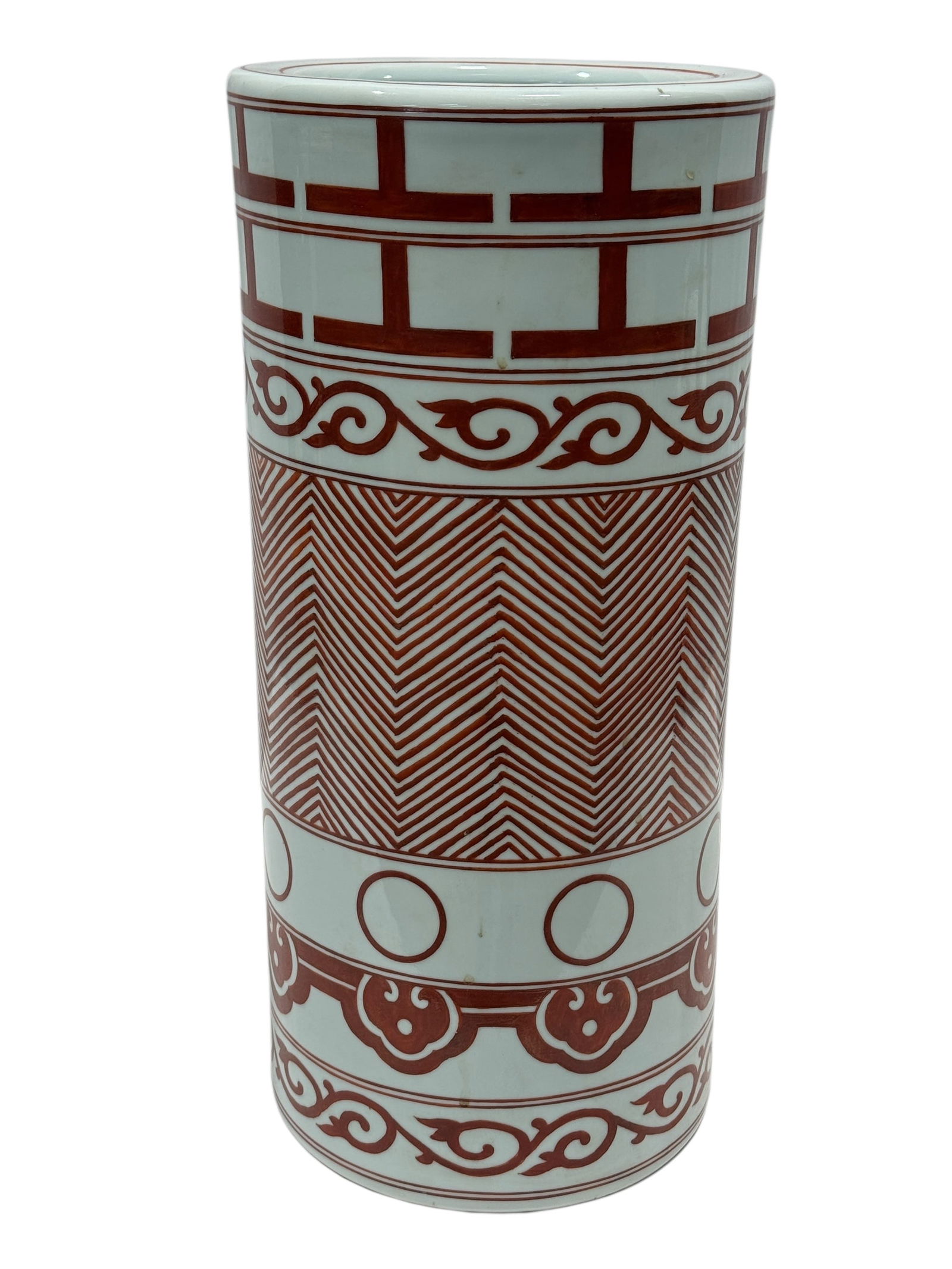 Mid-Century Chinese Porcelain Cylindrical Umbrella Stand: This mid-century Chinese porcelain cylindrical umbrella stand features a celadon-glazed ground richly decorated with iron-red geometric borders, scrolling vine motifs, circular medallions, and chevron