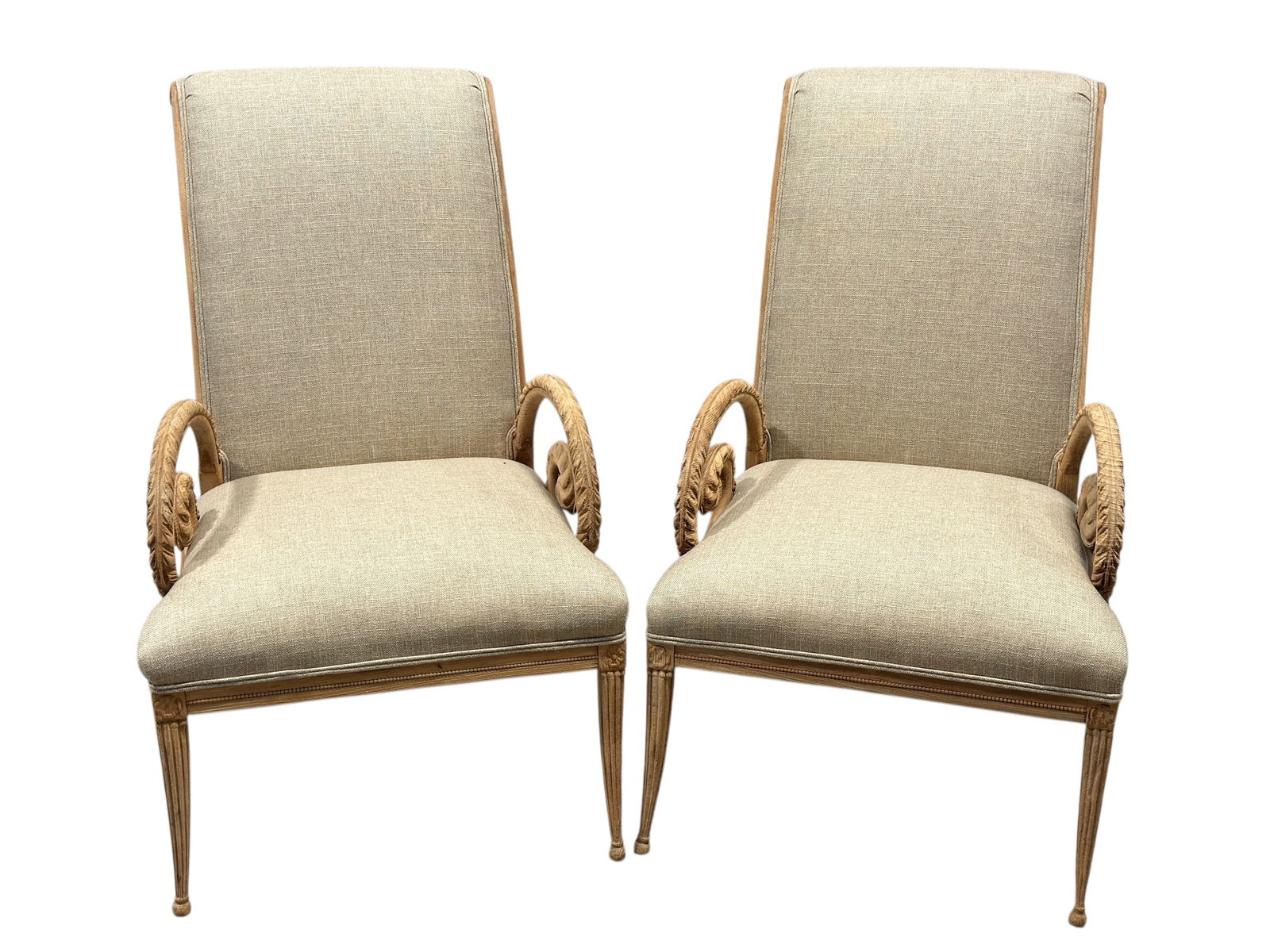 Pair of 1940s Hollywood Regency Grosfeld House Style Armchairs: This attractive Pair of 1940s Hollywood Regency Grosfeld House Style Armchairs, featuring elegant feather-carved scroll arms, tapered fluted legs, and classic proportions. The frames appear to be carv