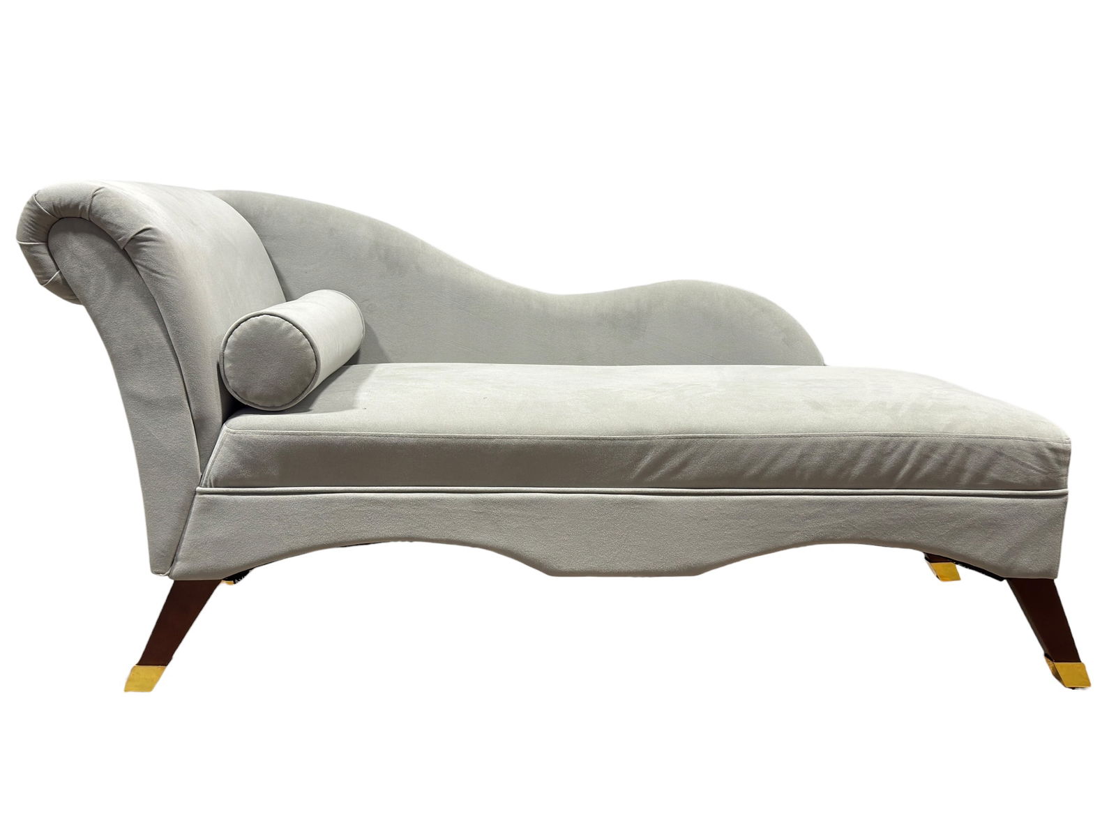 Contemporary Safavieh Upholstered Chaise Lounge: This contemporary Safavieh chaise lounge features a gracefully curved silhouette upholstered in a soft, pale neutral fabric, paired with tapered wooden legs finished with brass caps for a refined mode