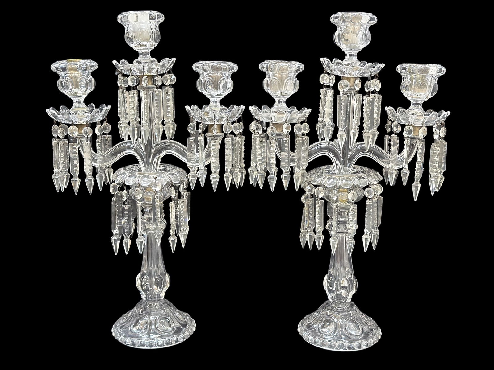 Pair of Fine 19th C. Baccarat Crystal 3 Arm Candelabras: A refined and elegant pair of authentic 19th century Baccarat crystal three-arm candelabra, showcasing the exceptional clarity, weight, and craftsmanship for which the celebrated French house is renow