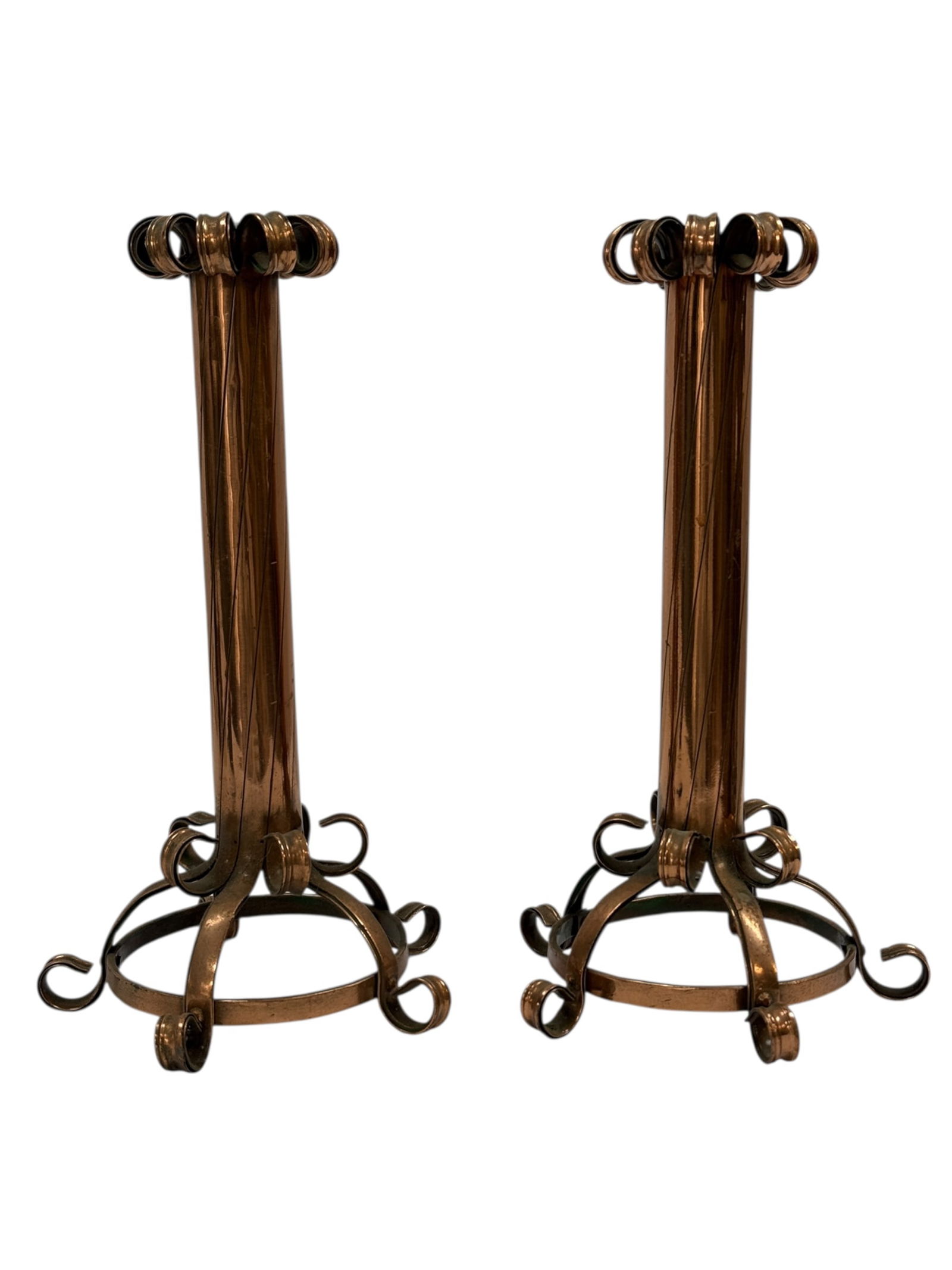 Early 20th C. Arts & Crafts Copper Candlesticks (Pair): A handsome pair of early 20th century Arts & Crafts copper candlesticks, hand-worked with strong vertical shafts rising to open circular candle cups, each formed with rolled and looped copper elements