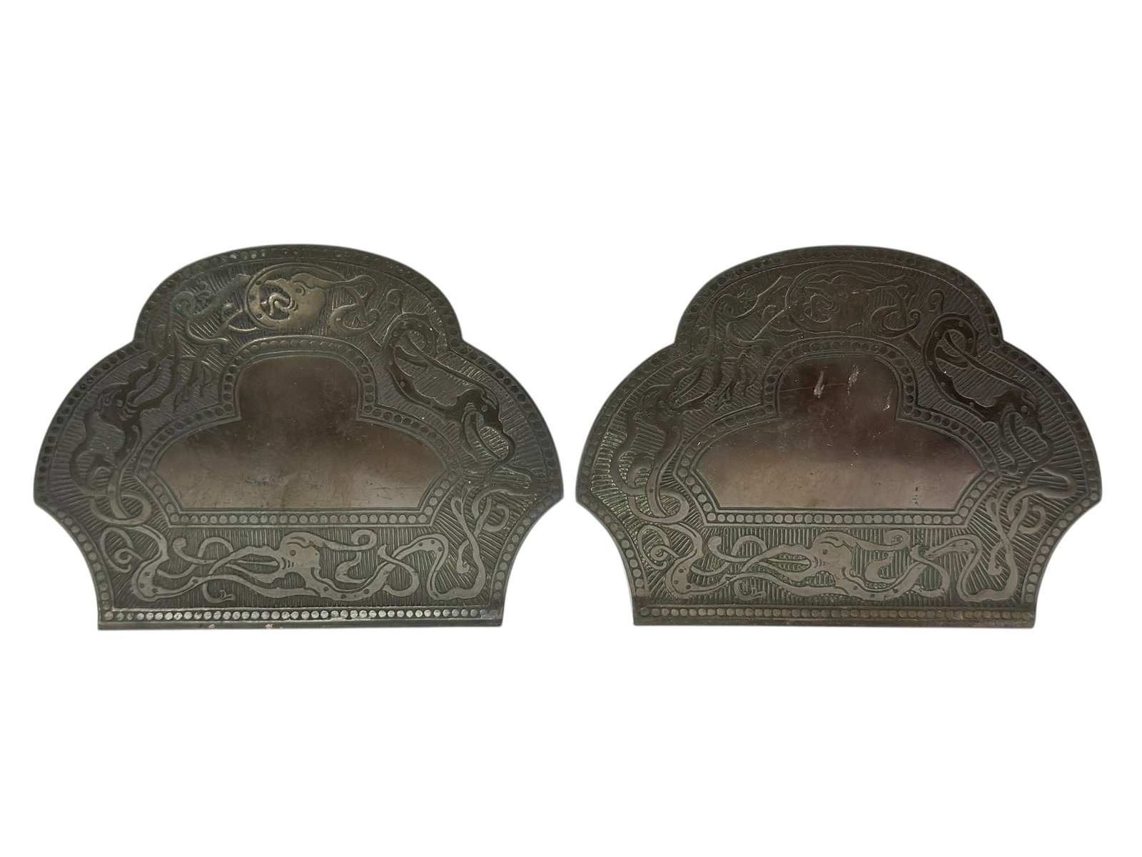 Early 20th C. Arts & Crafts Marshall Field & Co. “Artmetal Craft?? Bookends: A matched pair of Arts & Crafts period bookends retailed by Marshall Field & Co., produced under their desirable Artmetal Craft line, circa 1910–1925. Each bookend is formed of heavy patinated metal