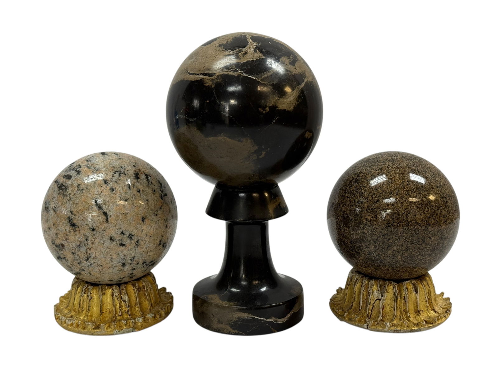 (3) 19th Century Grand Tour Marble Orbs: A decorative group of three Grand Tour marble orbs, comprising two loose spherical marble specimens and one black marble orb permanently mounted to its matching black marble base. The marbles display