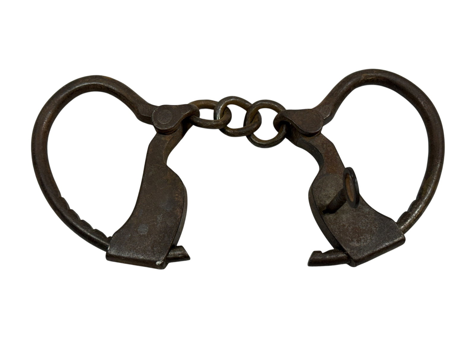 Early 19th Century Iron Handcuffs w/ Key: Early 19th century hand-forged iron handcuffs, joined by a short chain and retaining the original working key. The cuffs exhibit classic period construction with hinged oval wrist irons, ratcheting cl