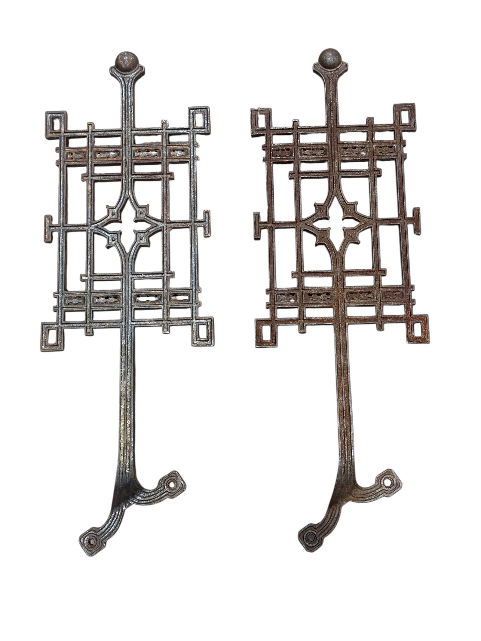 (2) Louis Sullivan Style Cast Iron Architectural Fragments: This striking pair of cast iron architectural fragments exhibits strong Louis Sullivan–influenced geometric design, featuring rectilinear latticework with stylized central quatrefoil and elongated f