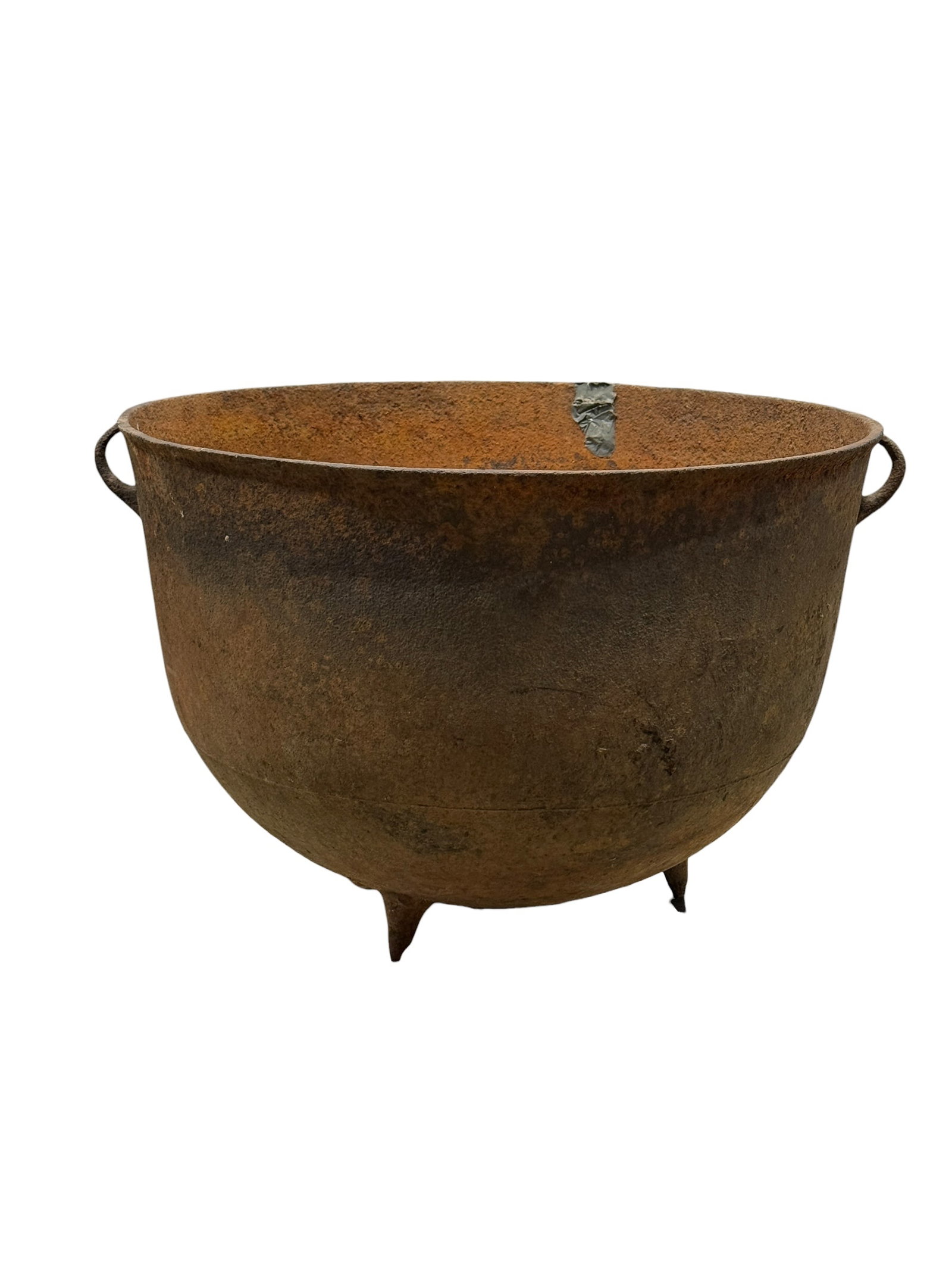 Large Cast Iron Cauldron w/ Bail Handles: This substantial cast iron cauldron features a classic deep rounded form with integral side bail handles and a heavy, utilitarian presence that reflects its historic functional roots, making it an exc
