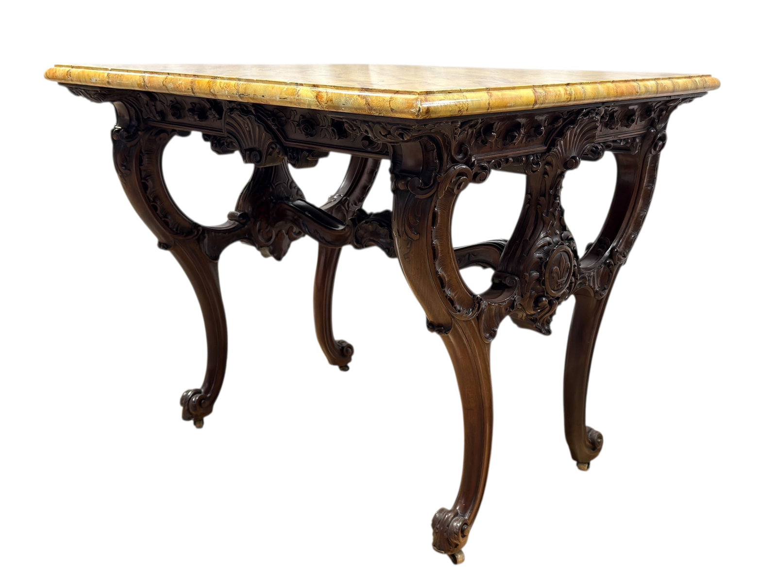 19th C. French Carved Walnut Table w/ Faux Marble Painted Top: This elegant 19th century French table features a richly carved walnut base showcasing flowing cabriole legs, pierced supports, and finely detailed floral and scroll motifs, highlighted by a central c