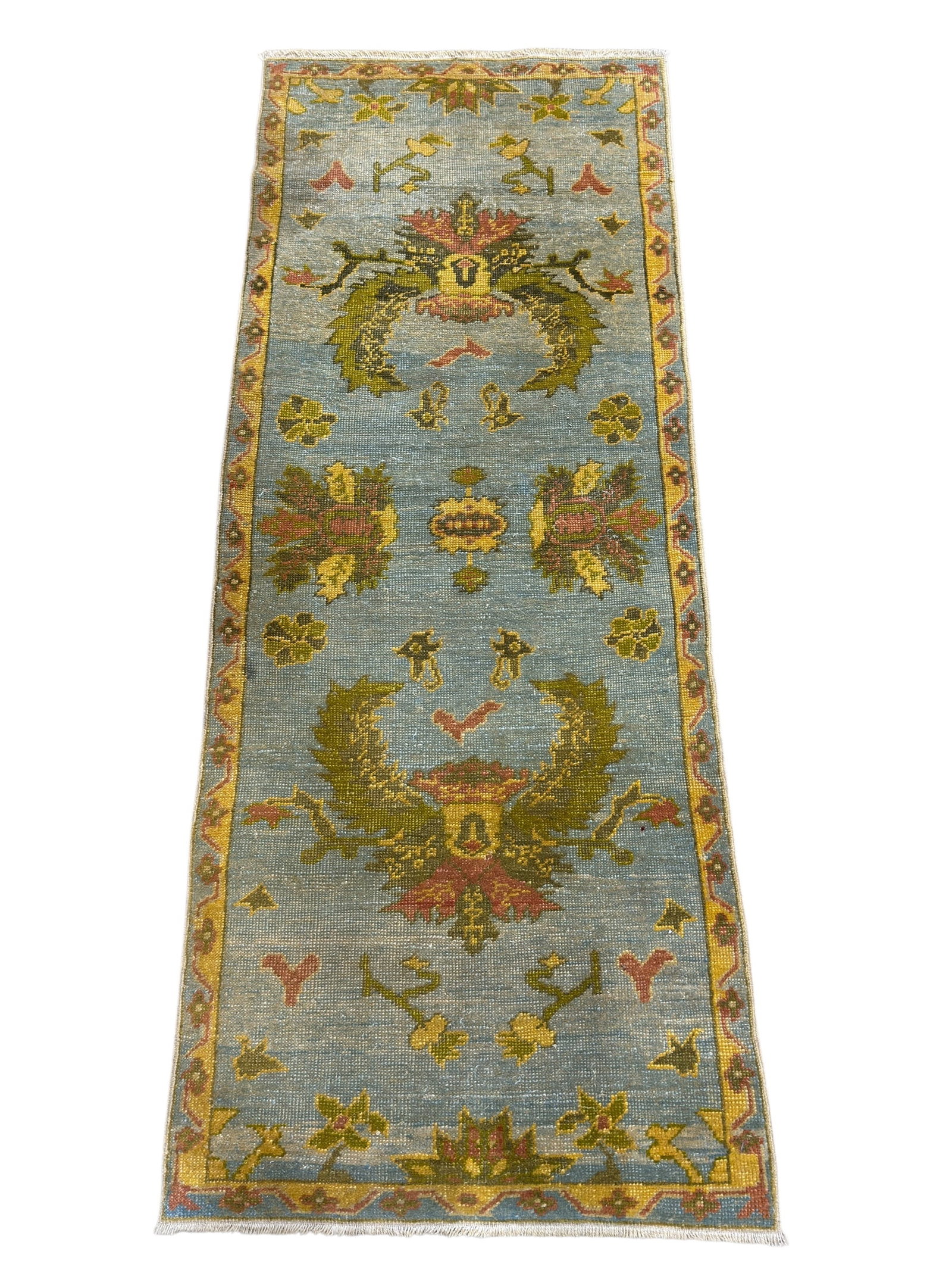 Hand-Knotted Oriental Persian Runner: This hand-knotted Oriental Persian runner features a soft blue-green ground with stylized floral and foliate motifs arranged in a balanced, symmetrical layout, framed by a complementary border in warm