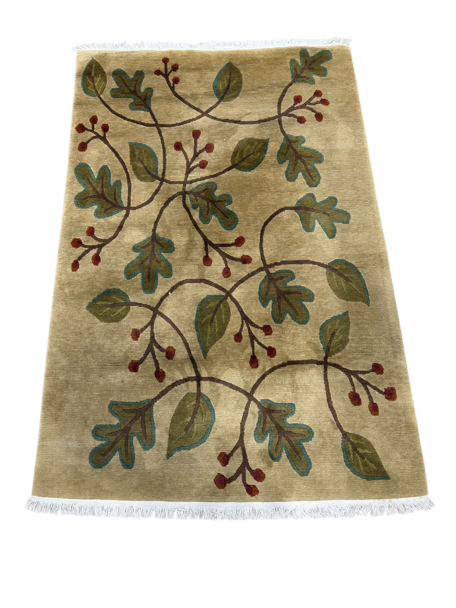 Stickley Arts & Crafts Wool Area Rug: This Stickley Arts & Crafts–style wool area rug dates to the late 20th century and features a stylized botanical vine design with scrolling branches, oak leaves, and berry motifs rendered in muted e