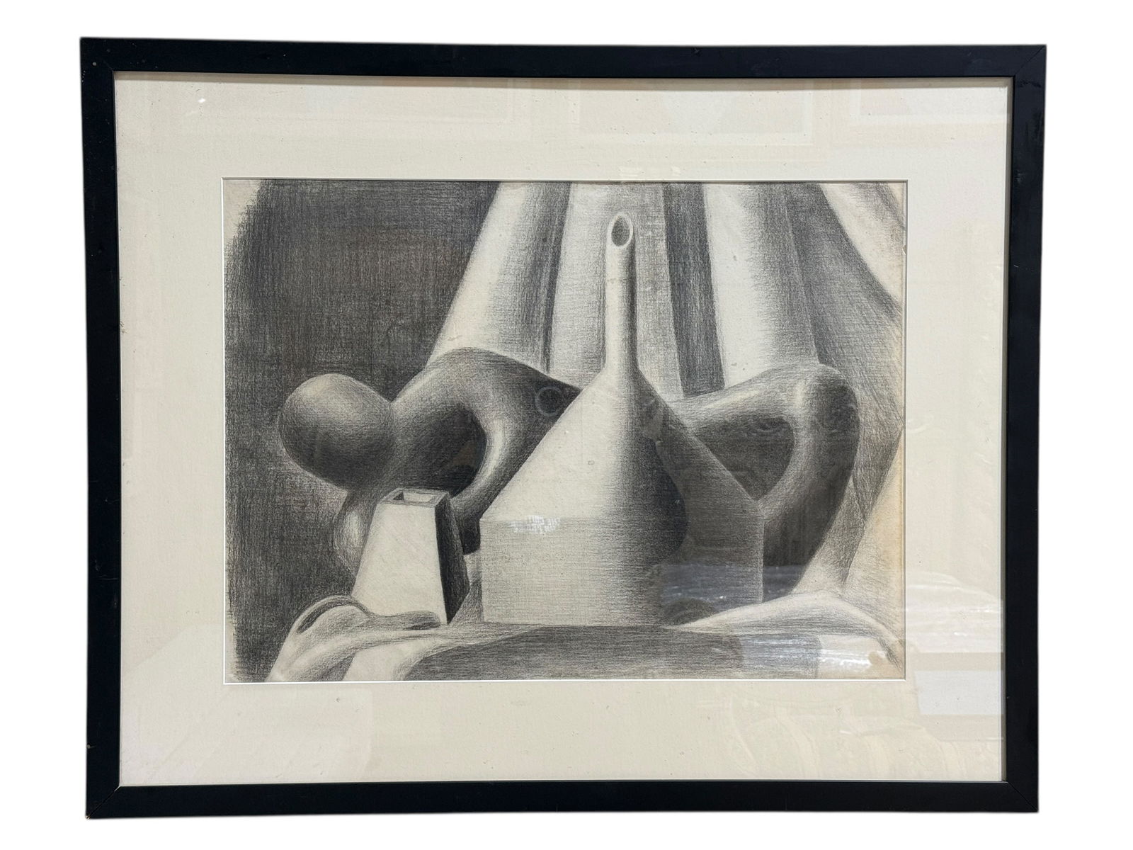 Framed Contemporary Charcoal Still Life Drawing: This contemporary framed charcoal (or graphite) still life depicts a grouping of vessels rendered with strong tonal contrast and soft shading, presented in a simple black frame with off-white matting,
