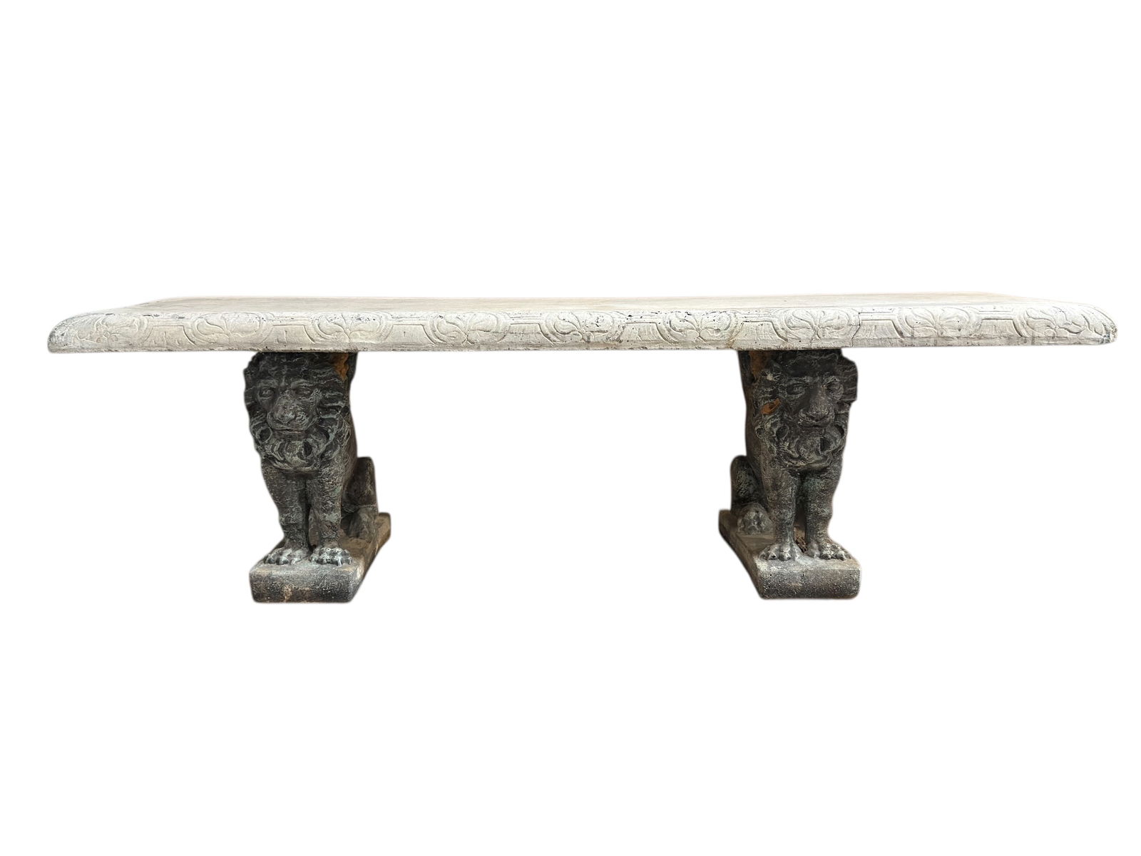 Carved Stone Garden Bench w/ Classical Lion Supports: This substantial carved stone garden bench features a rectangular molded top with repeating floral relief along the edge, supported by two sculptural lion-form bases with weathered patina, creating a