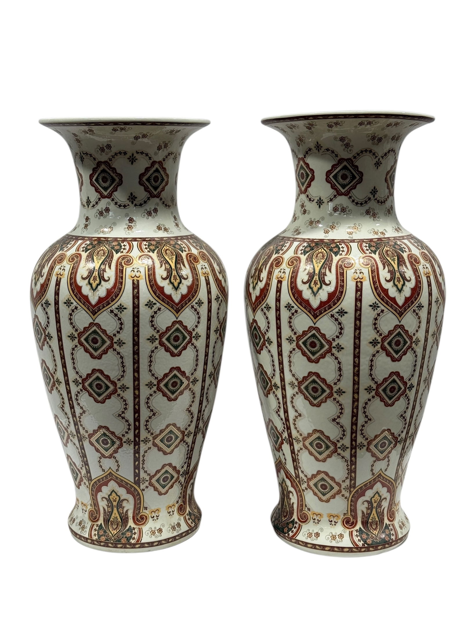 Pair of Decorative United Wilson Floor Vases: A matched pair of large decorative floor vases by United Wilson, each executed in glazed ceramic with a tall baluster form flaring to a wide rim and richly decorated overall with repeating geometric a