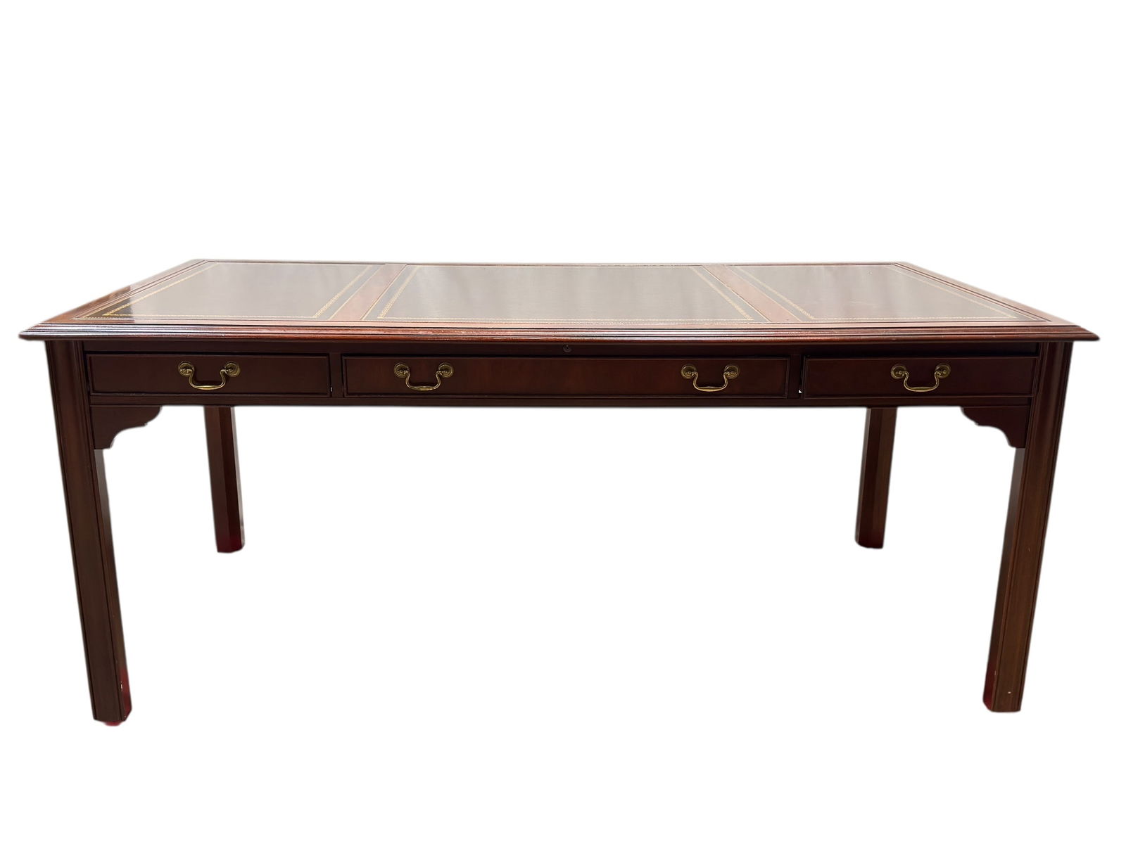 Sligh Furniture Leather-Top Writing Desk: This elegant Sligh Furniture writing desk features a richly finished wood frame topped with a classic leather writing surface divided into three panels and accented with decorative gilt tooling, offer