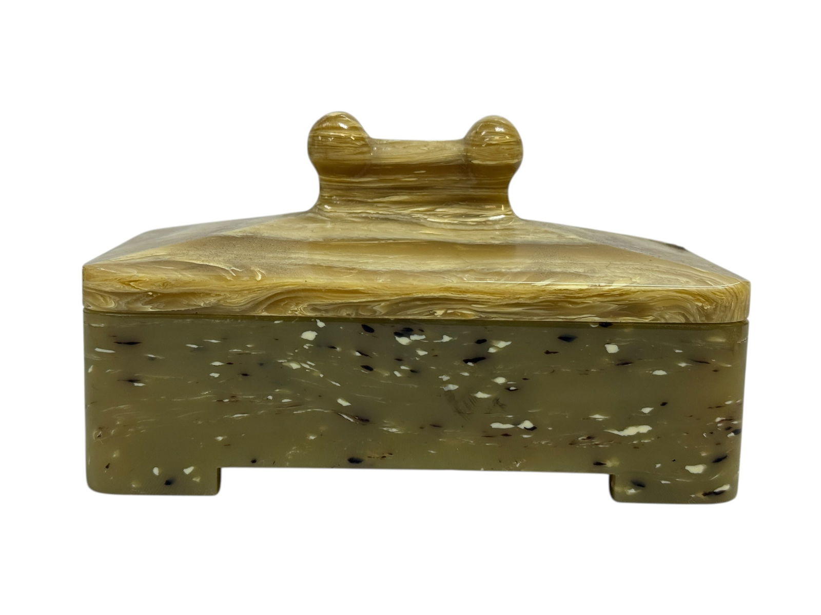 Art Deco Mottled Bakelite Hinged Box: Striking Art Deco era Bakelite box featuring a deep olive-green body with dramatic black and white confetti-like inclusions, topped with a richly swirled butterscotch marbleized lid and matching handl
