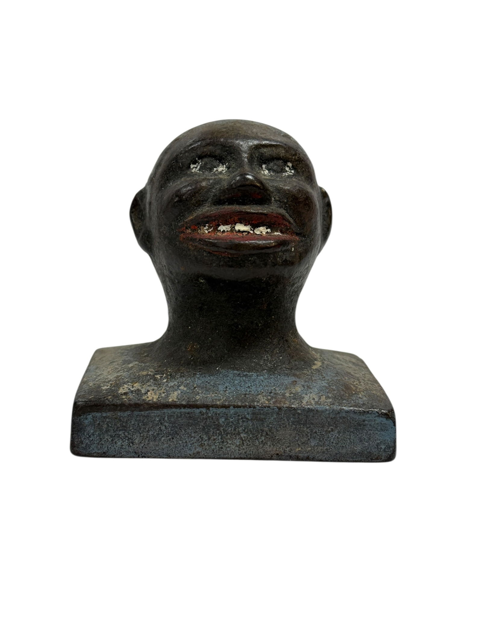 19th C. Cast Iron Black Americana Figural Paperweight: A scarce 19th century cast iron figural paperweight depicting a stylized head-and-bust form on a square base, retaining traces of original painted decoration including red detailing at the mouth and w