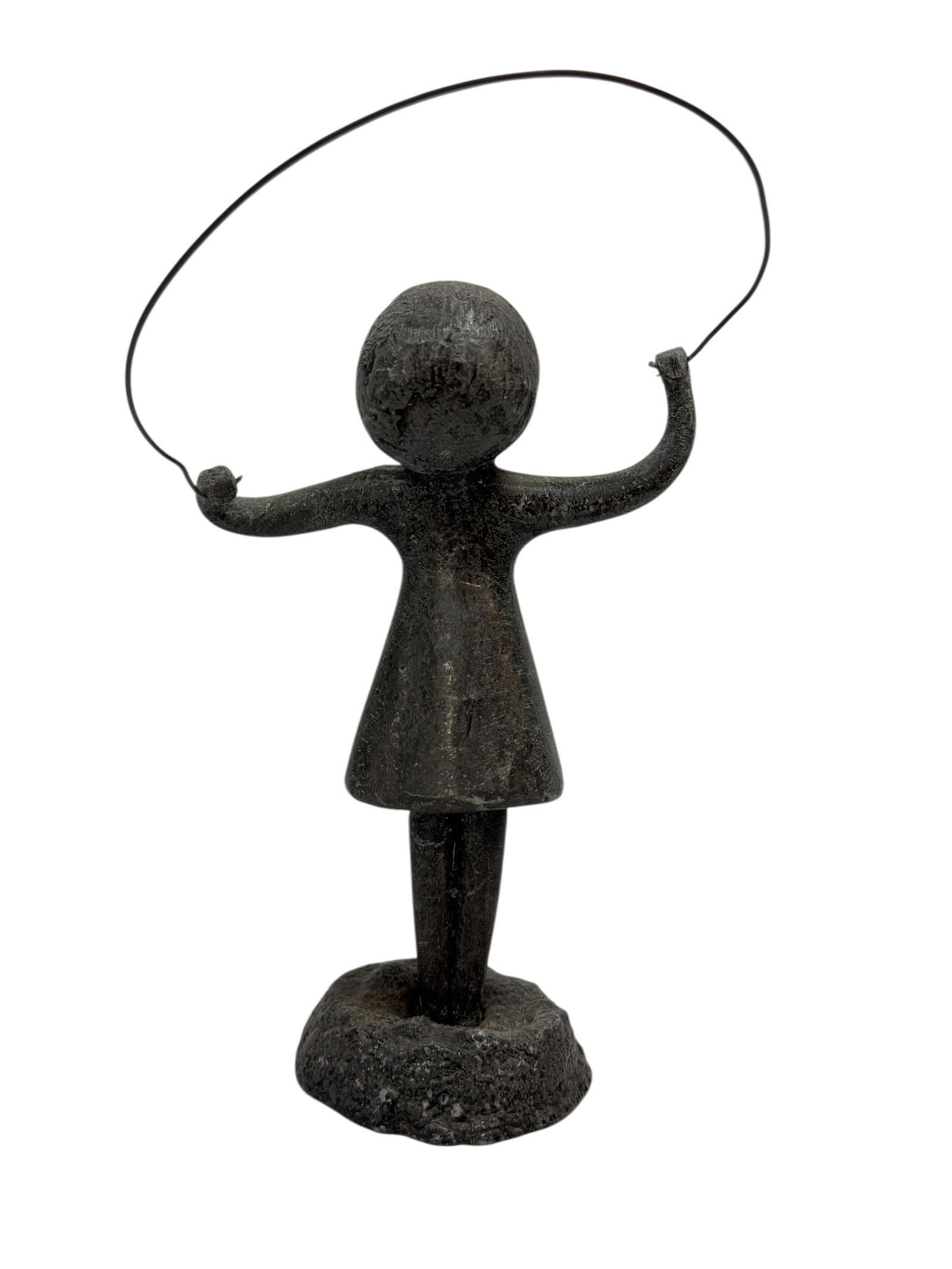 Mid Century Lead "Girl Jump Rope" Sculpture: Charming mid-century sculptural figure depicting a young girl posed mid–jump with her rope held overhead, cast in a dark lead or heavy metal with a wonderfully simple, modernist silhouette and