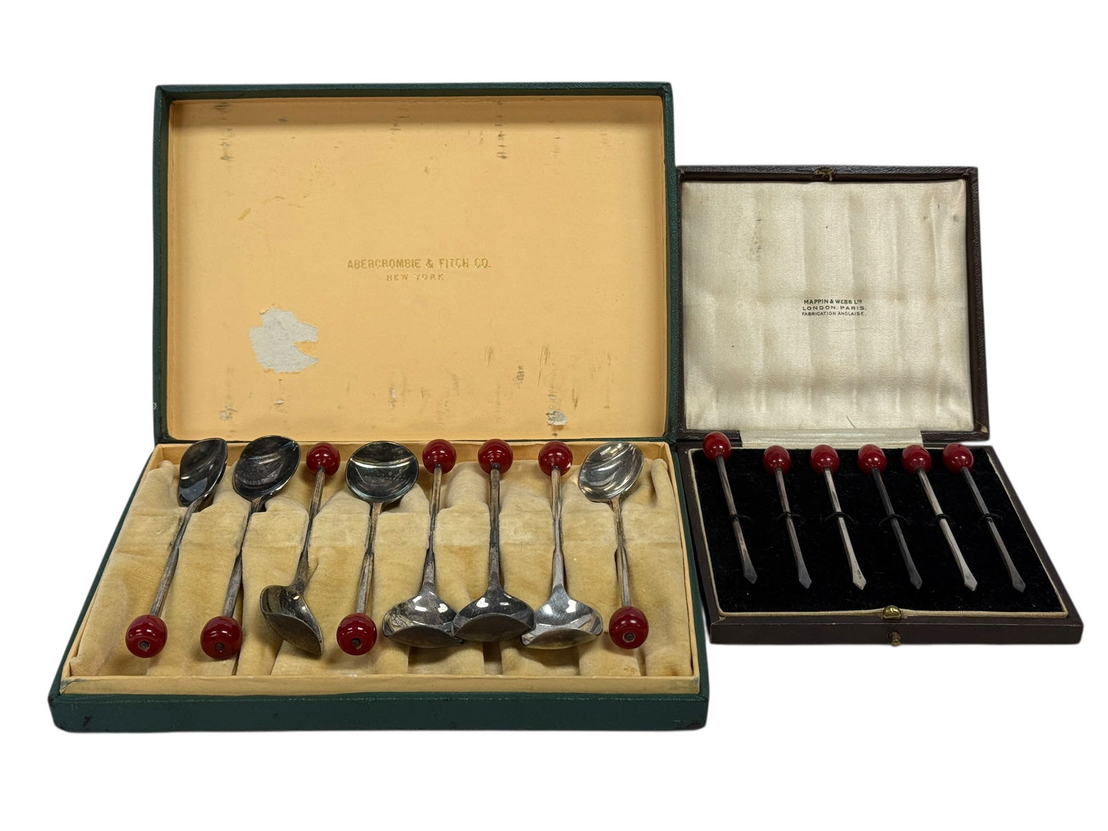 Bakelite Abercrombie & Fitch Spoons and Mappin & Webb Olive Picks: A charming vintage barware grouping featuring two original fitted presentation cases, one marked Abercrombie & Fitch Co., New York and the other marked Mappin & Webb Ltd., London–Paris, each