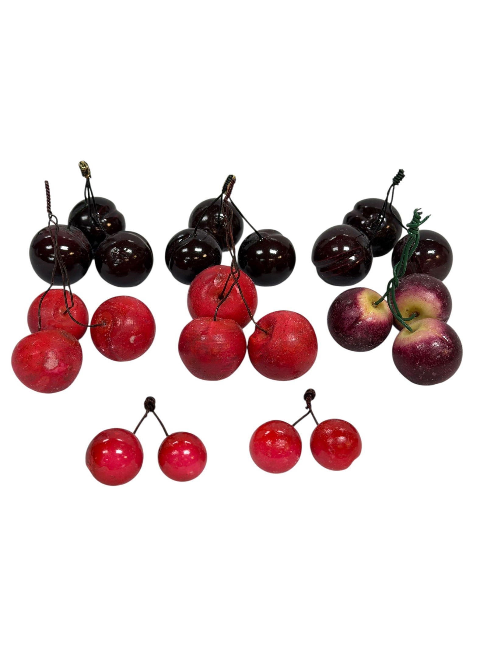 Sets of Decorative Italian Carved Stone Cherries: harming vintage Italian decorative stone cherry groupings, featuring multiple clusters in rich deep burgundy, bright red, and purple-toned fruit, each carved and polished to resemble realistic cherrie