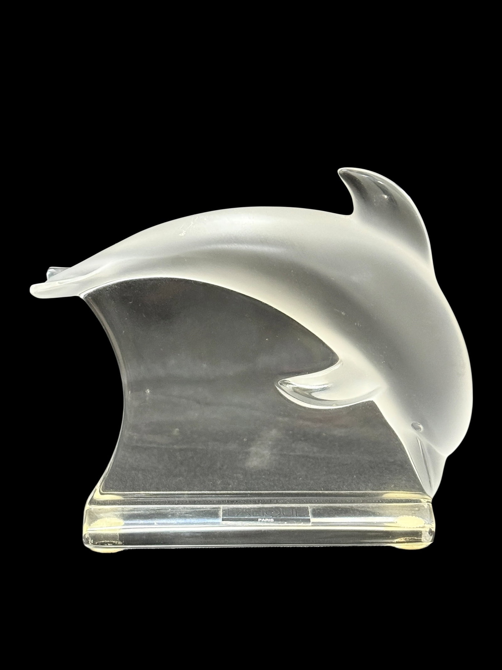 Lalique Frosted Dolphin Sculpture: Elegant Lalique crystal dolphin figure featuring a sleek arched form in satin-frosted glass, mounted on a clear wave-style base with the signature “Lalique Paris” plaque. This beautifully