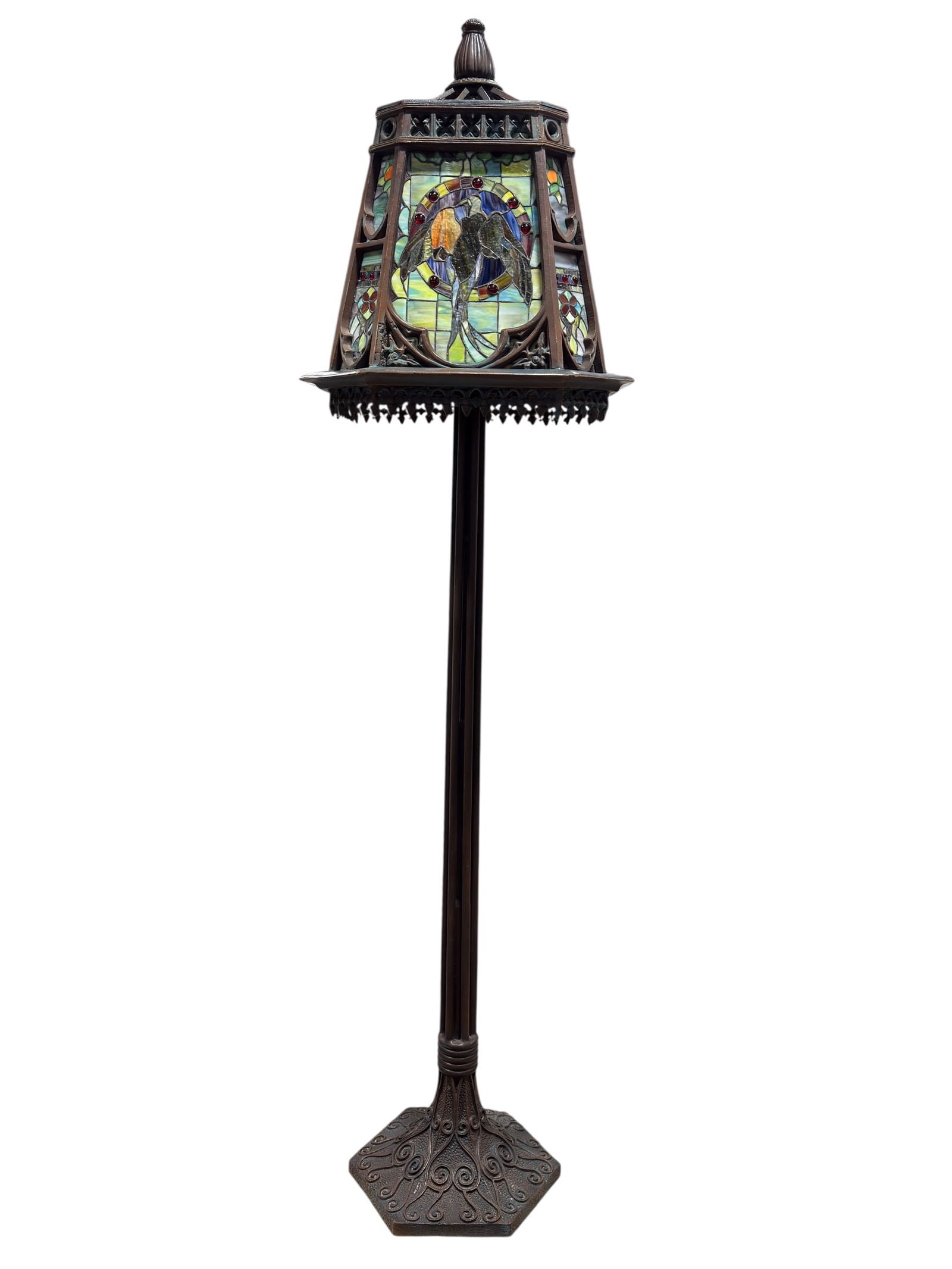 Arts & Crafts Style Birds Stained Glass Floor Lamp: Impressive Art Nouveau style stained glass floor lamp featuring a large, multi-panel shade set in an ornate pot metal frame with pierced gallery and decorative finial, each primary panel depicting a s