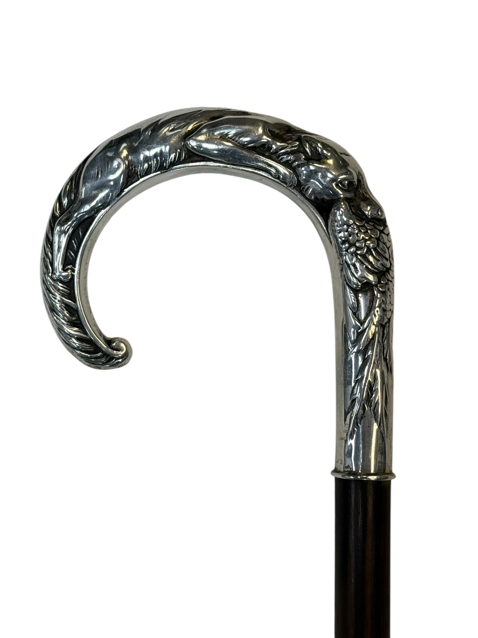 Circa 1900 Silver Fox and Pheasant Handle Dress Cane: An exceptional circa 1900 Continental silver-mounted dress cane featuring a dramatic high-relief crutch handle sculpted with a full-figure fox in pursuit of a pheasant, the detailed composition wrappi