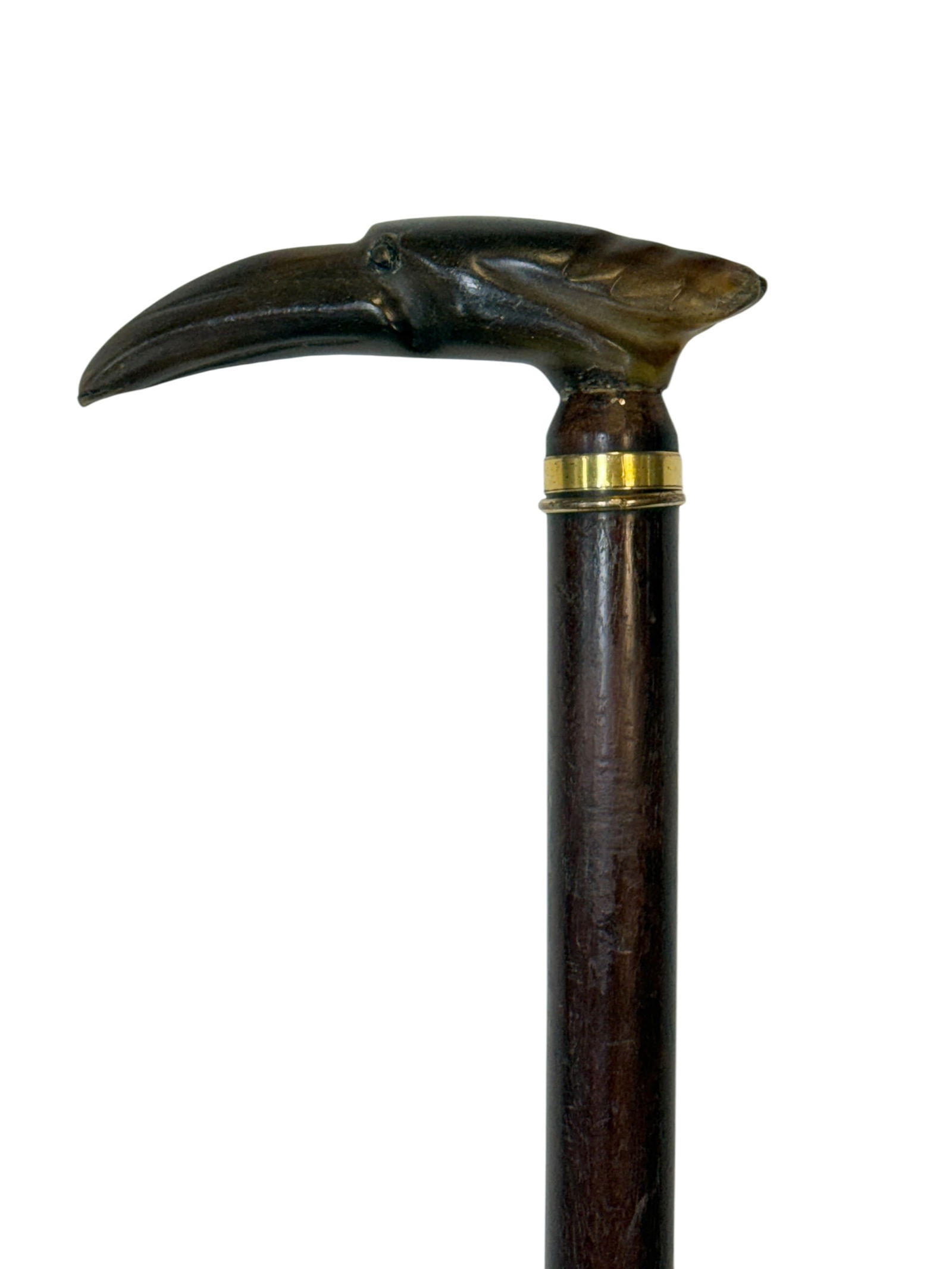 Antique Carved Horn Bird Head Dress Cane: Striking antique carved horn bird head dress cane, the handle finely modeled with a sharply hooked beak, defined eye, and carved feather detailing flowing back along the head, executed in richly toned