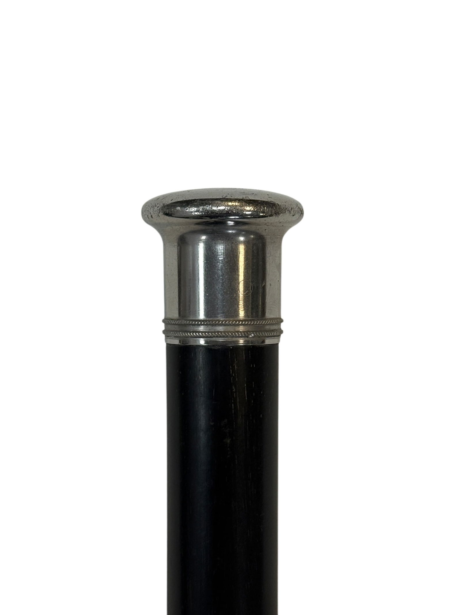 Antique Silver-Top Twisted Hardwood Walking Cane: Antique gentleman’s walking cane featuring a smooth silver-tone metal top with a wide rounded cap and decorative banding above a finely carved dark hardwood shaft with an elegant spiral twist de