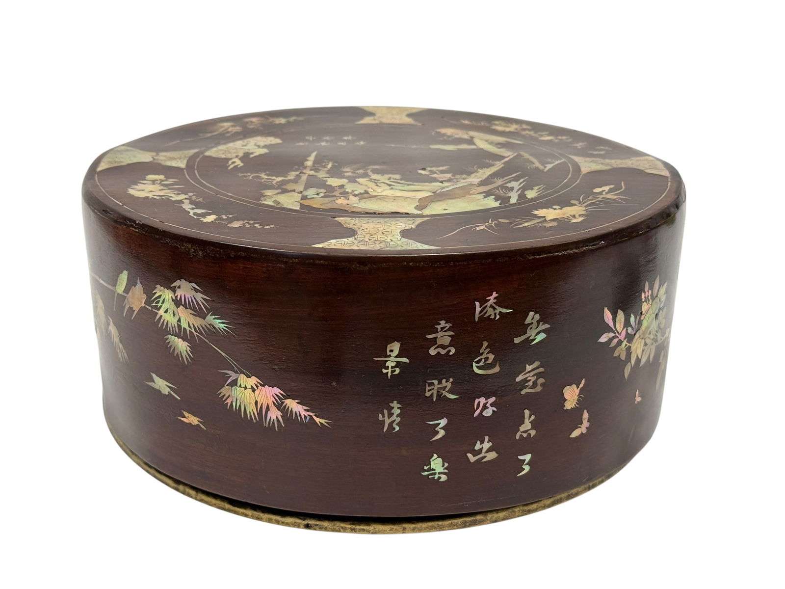 Antique Asian Mother-of-Pearl Inlaid Wooden Box: Antique Asian hardwood box of circular form, beautifully inlaid throughout with iridescent mother-of-pearl depicting traditional landscapes, figures, birds, florals, butterflies, and calligraphic scri